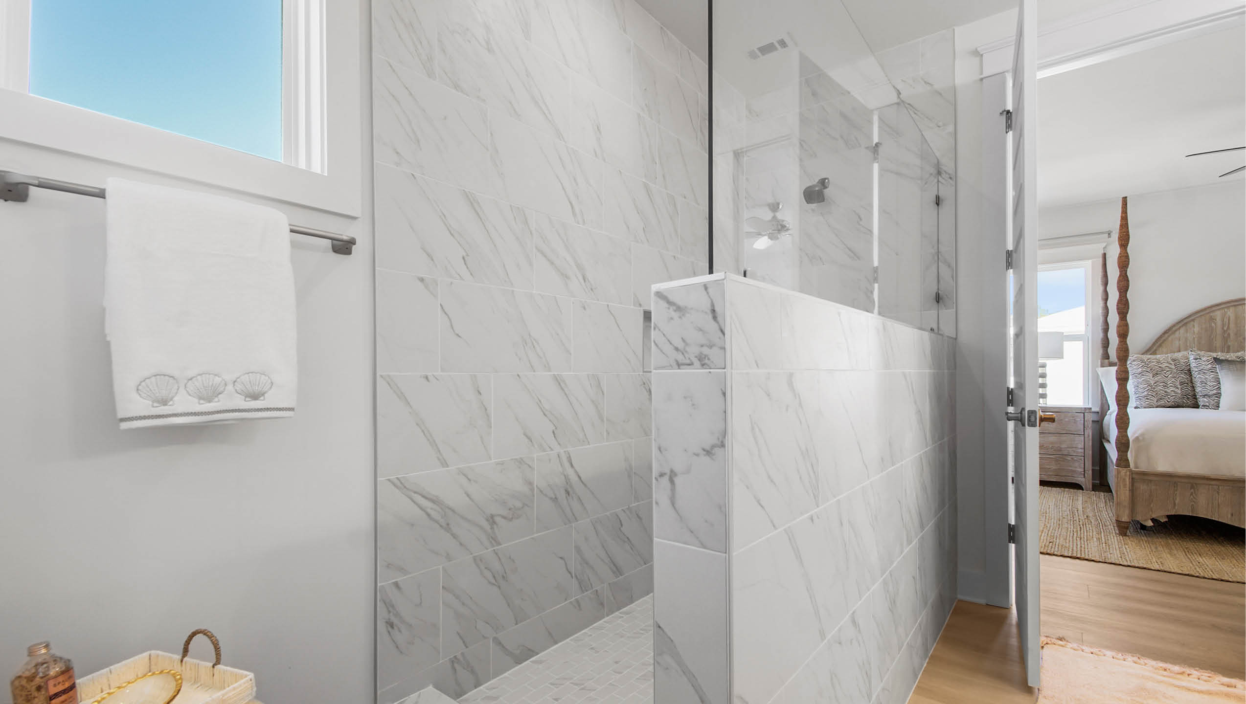 Primary bathroom with open shower and glass partition