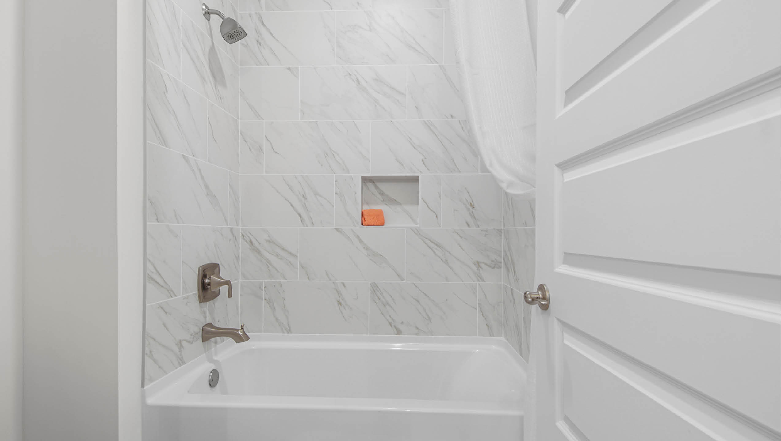 Shared bathroom with shower tub combo