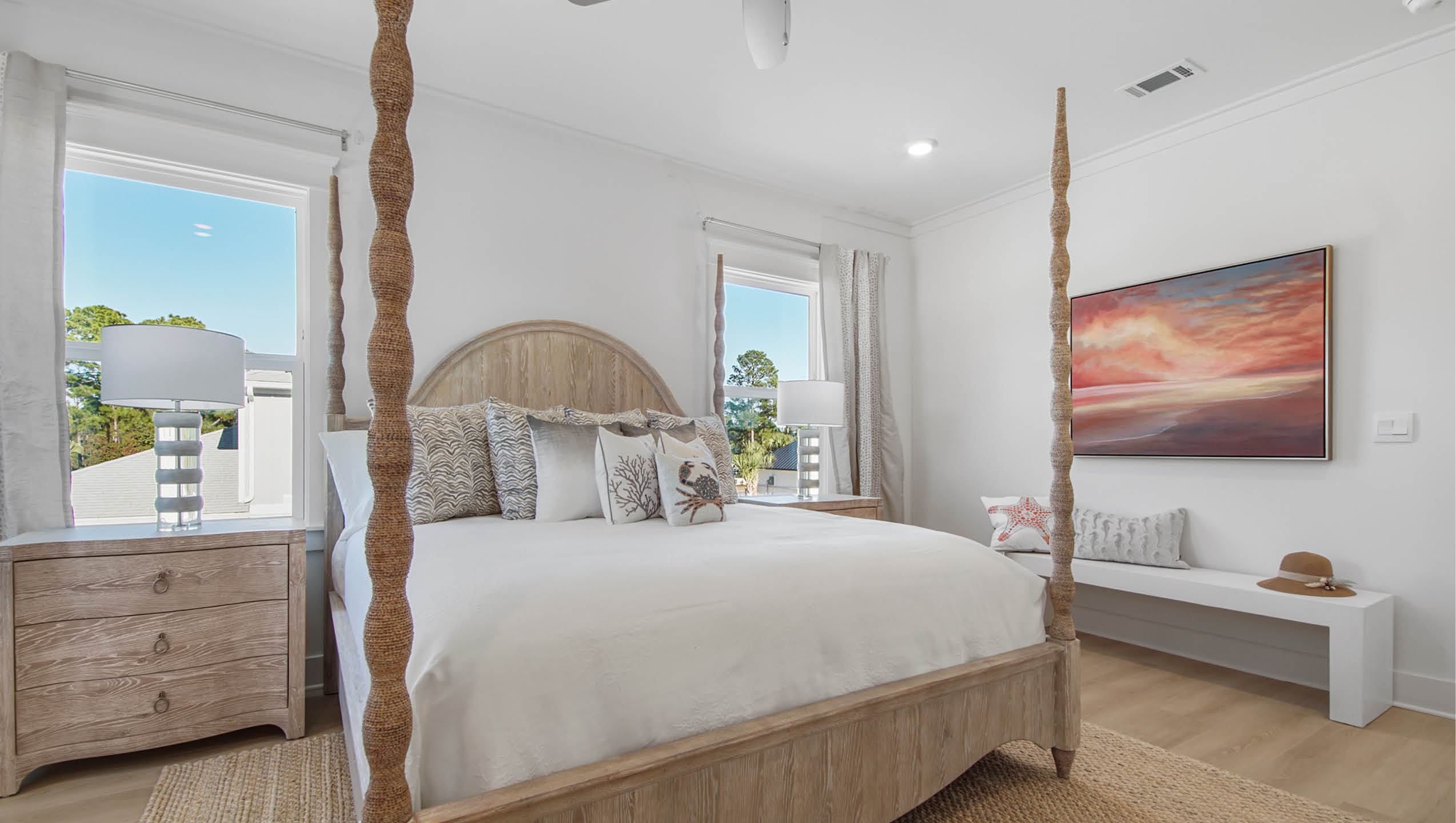 Primary bedroom with windows for natural light