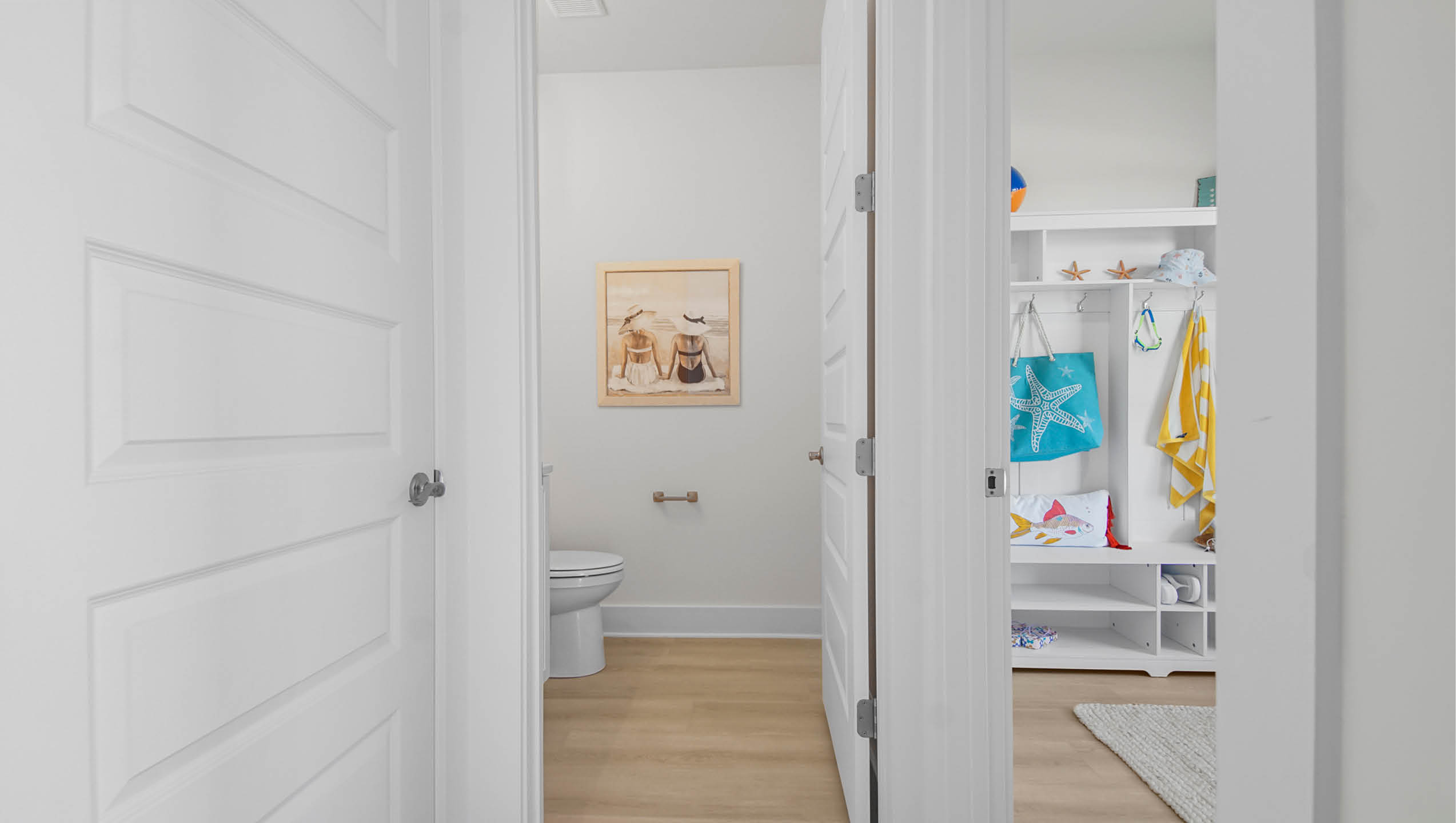 Hall leading to half bath and office