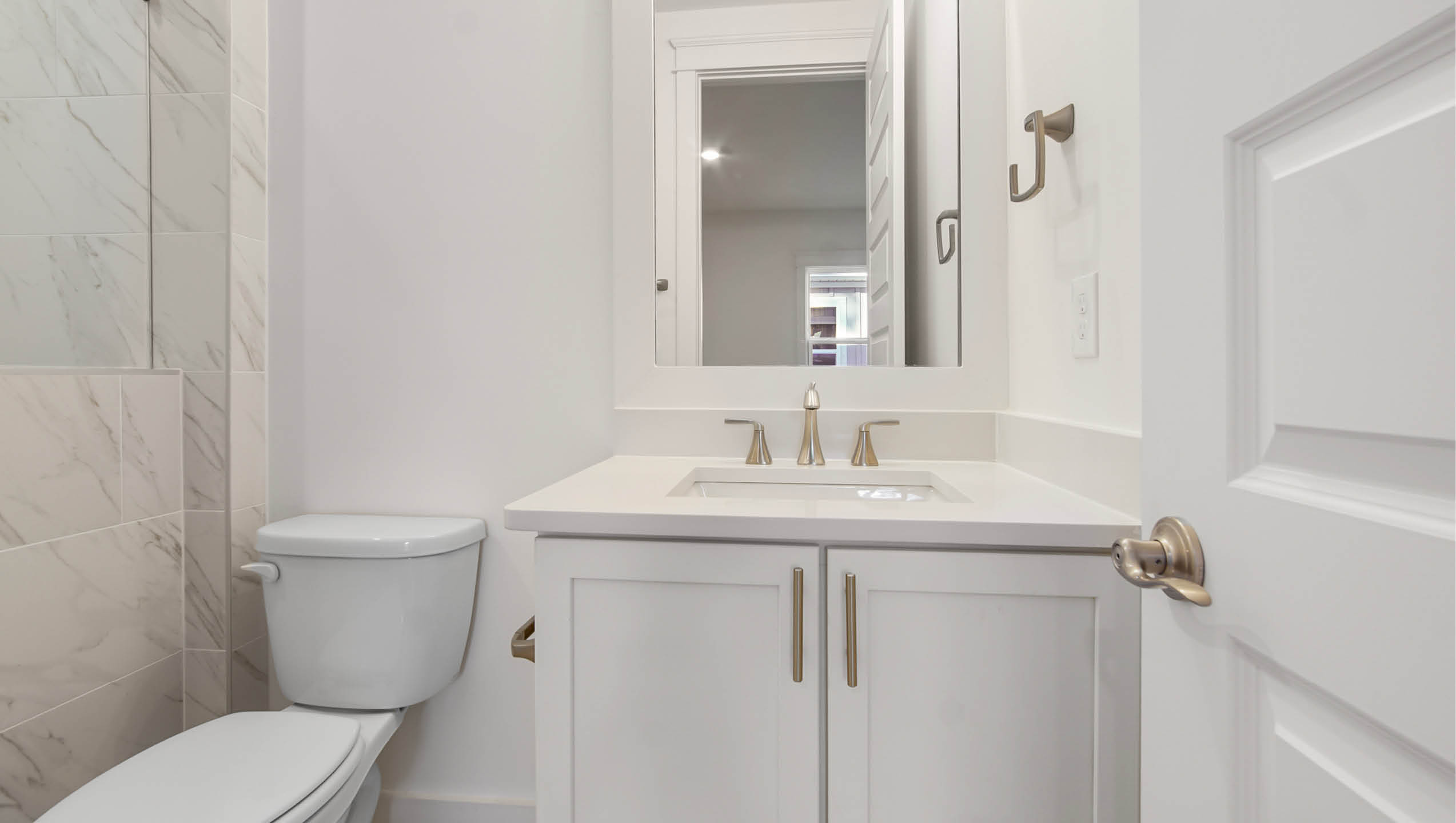 Bedroom four bath with vanity and quartz countertop and lower cabinetry