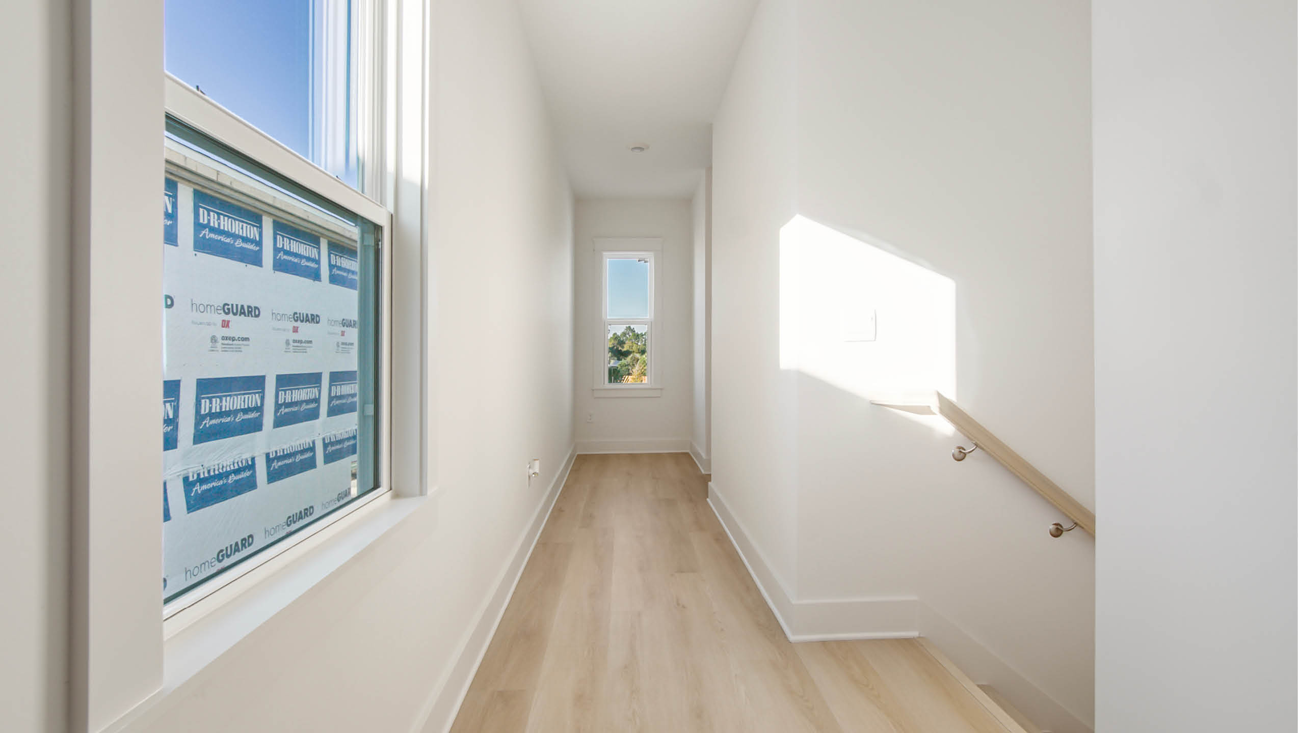 Second level hallway leading to bedrooms three four and five