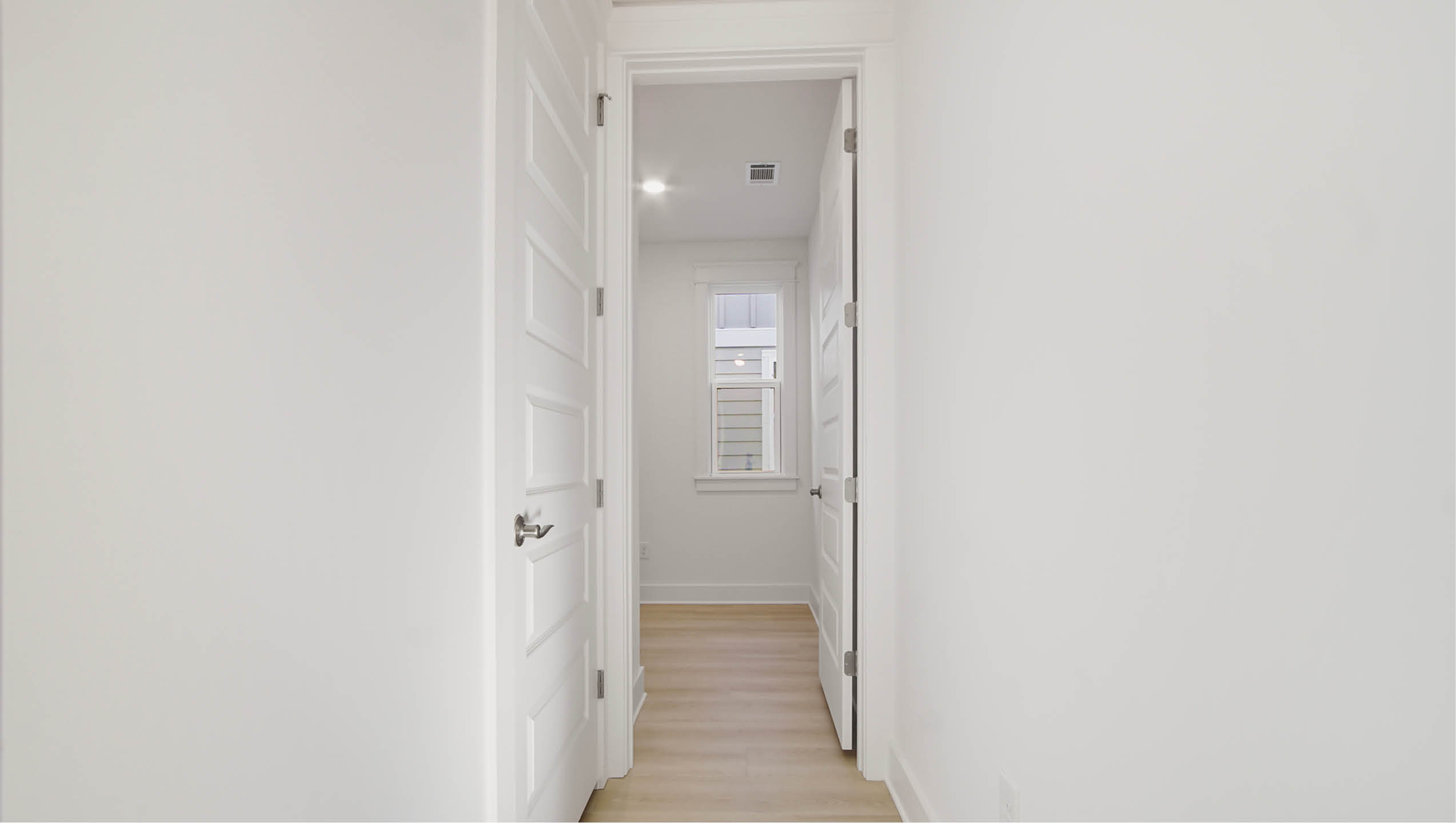 Main level hallway leading to office and power room