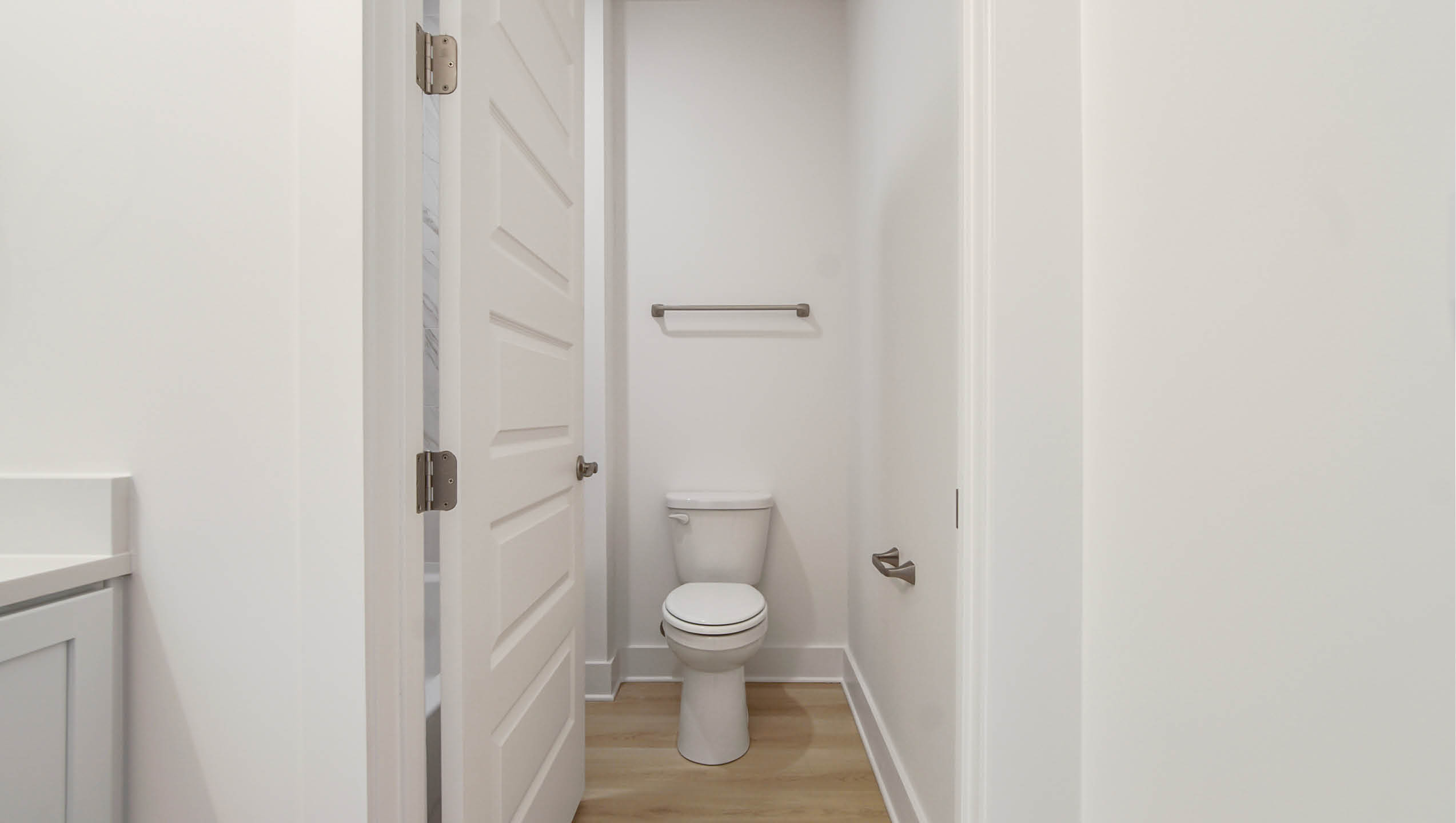 Shared bathroom with separate water closet and shower tub combination