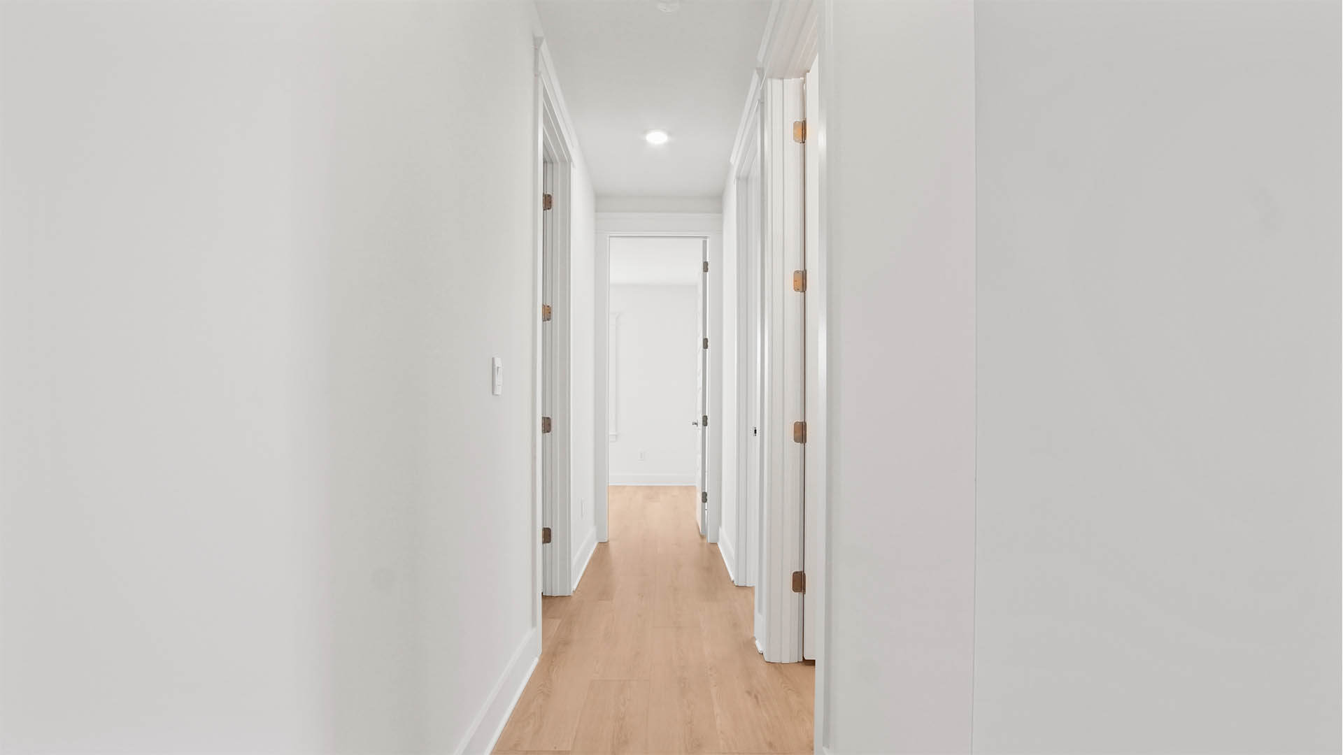 Second level hallway leading to bedrooms 2 through 5