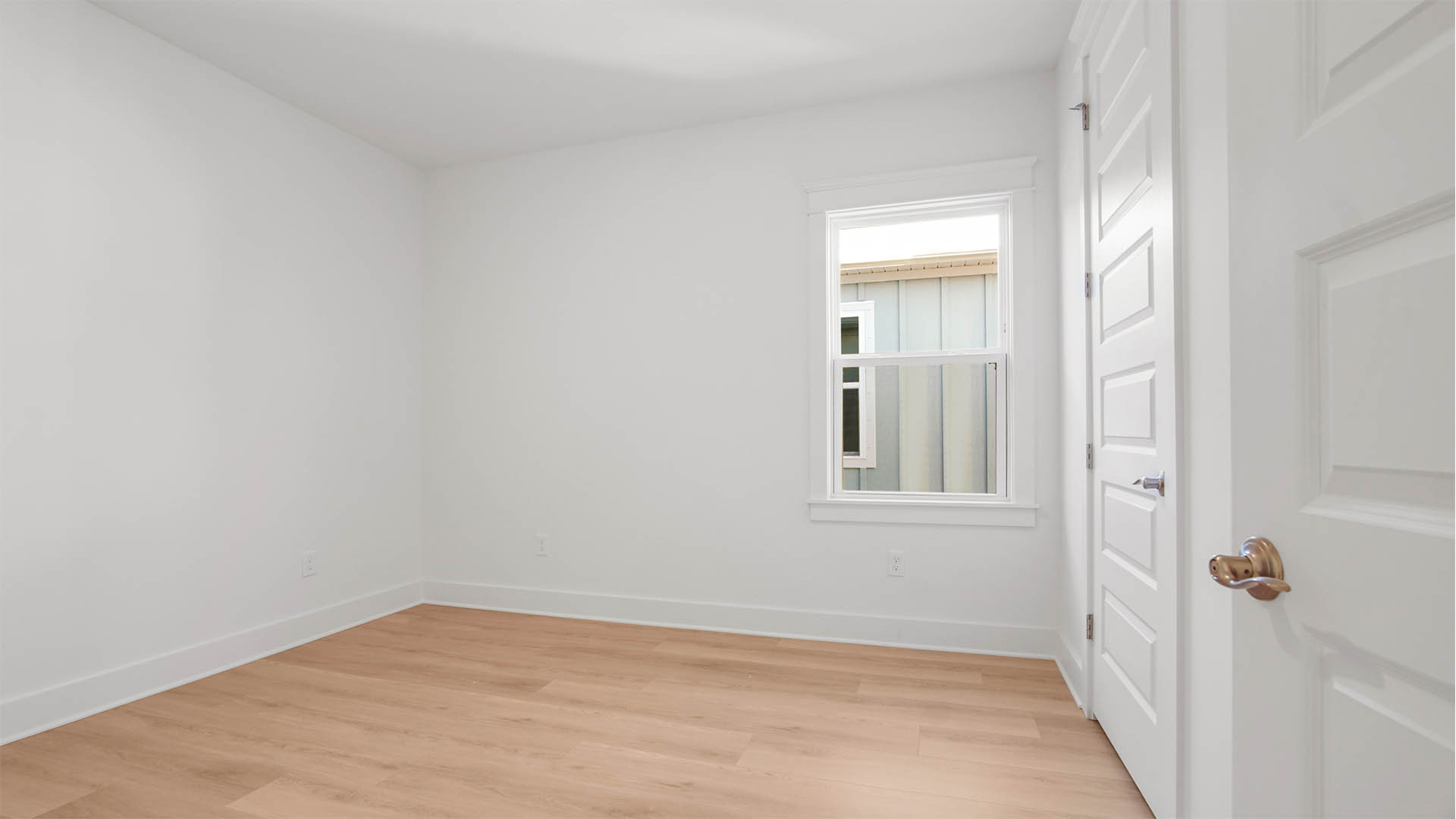 Bedroom four with wood flooring