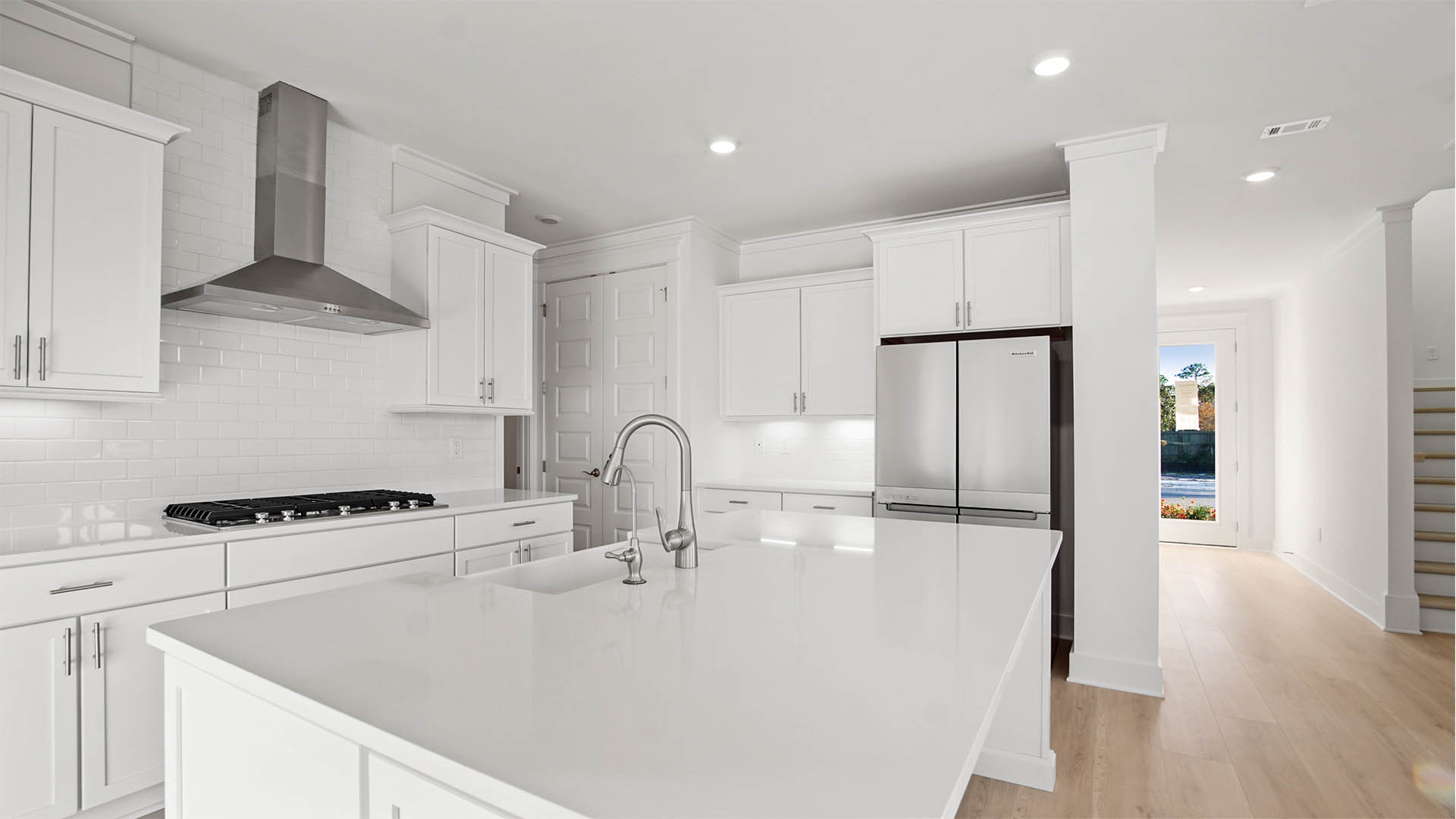 Kitchen features a gas range with good vent