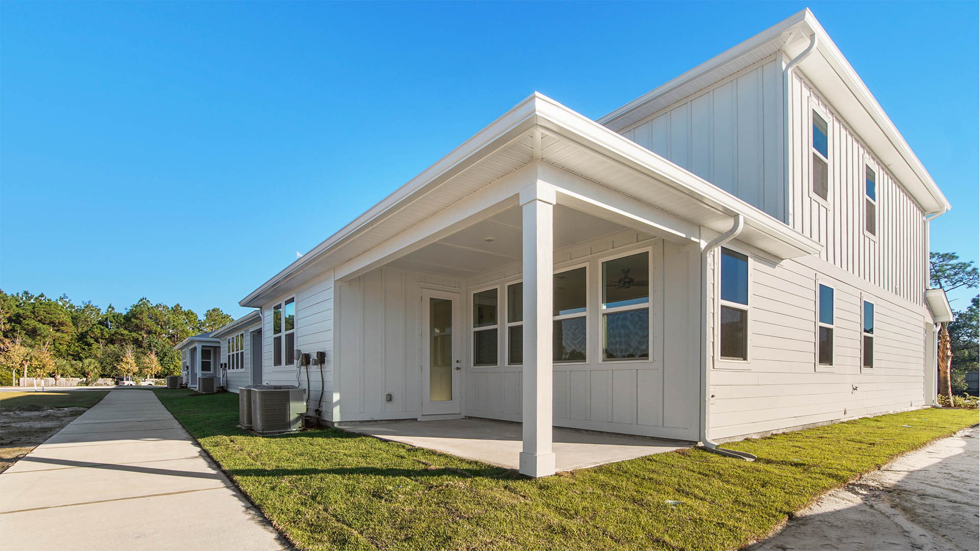 Covered back patio with space for dining table and chairs or seating area.