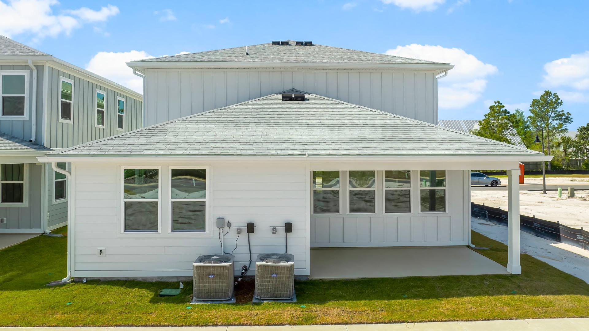 The back of the home has covered patio