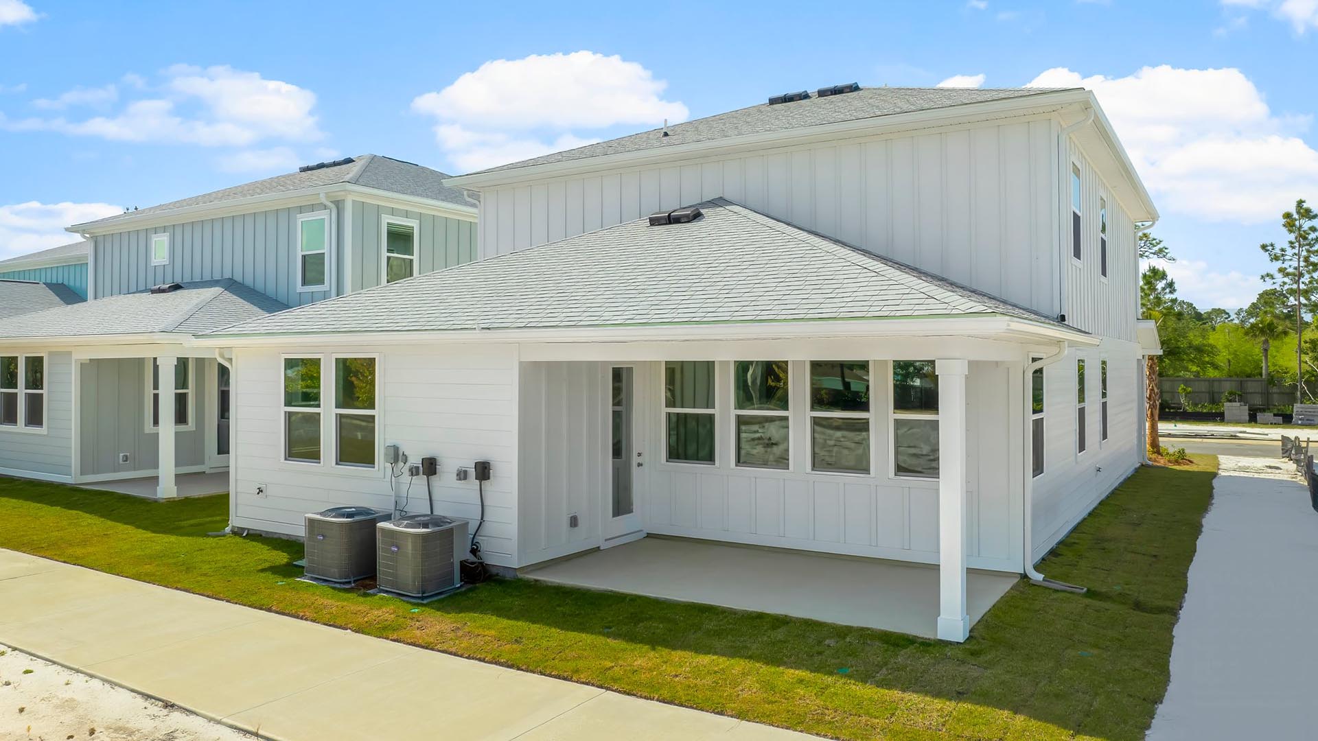 The covered patio has space for an outdoor dining area