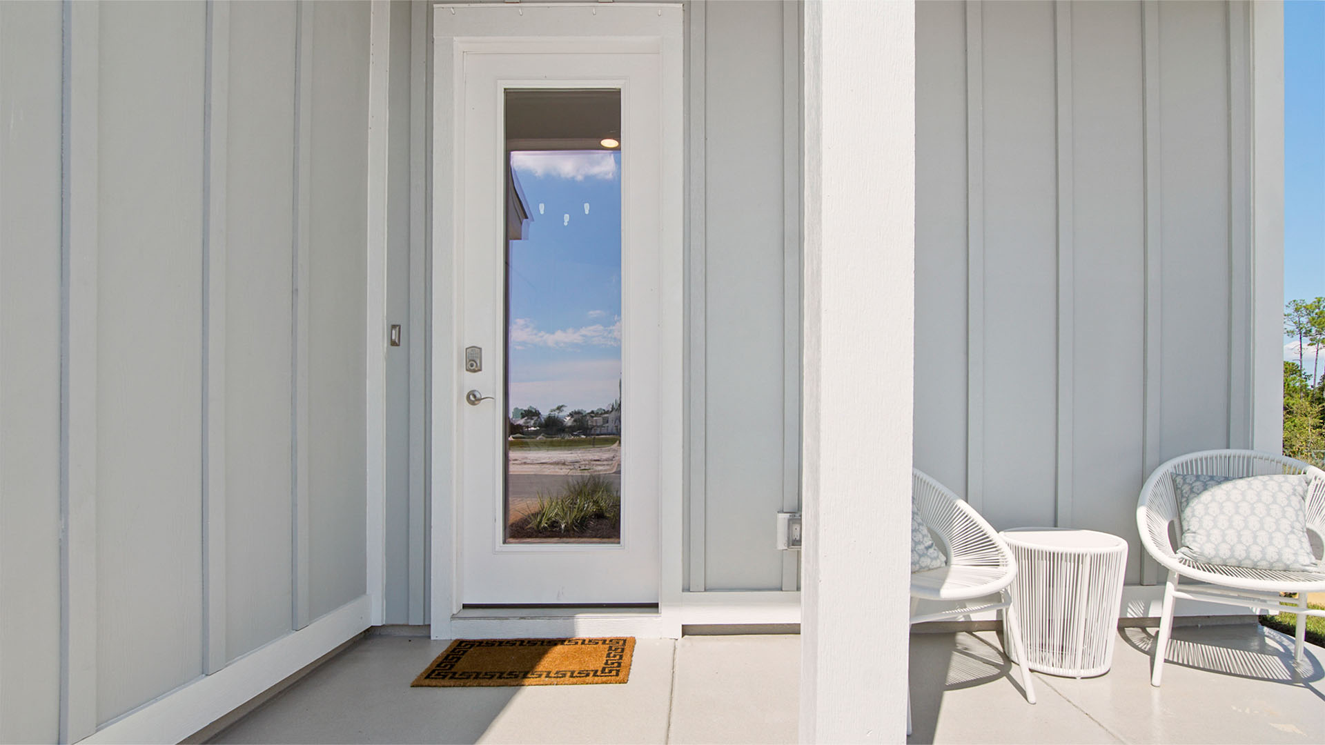 Brayden floorplan covered front patio and glass front door.