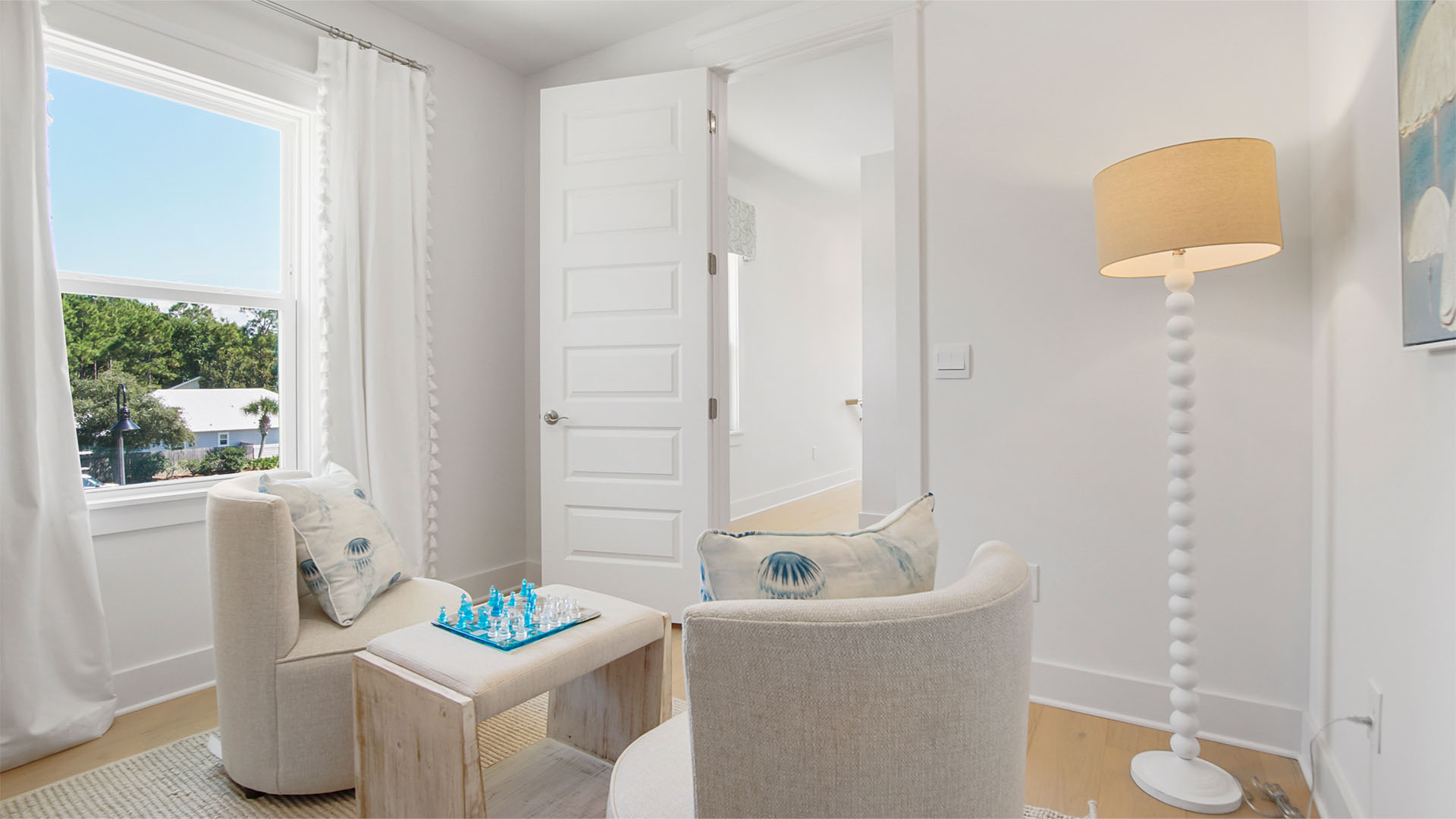 Flex room with window and wood flooring.