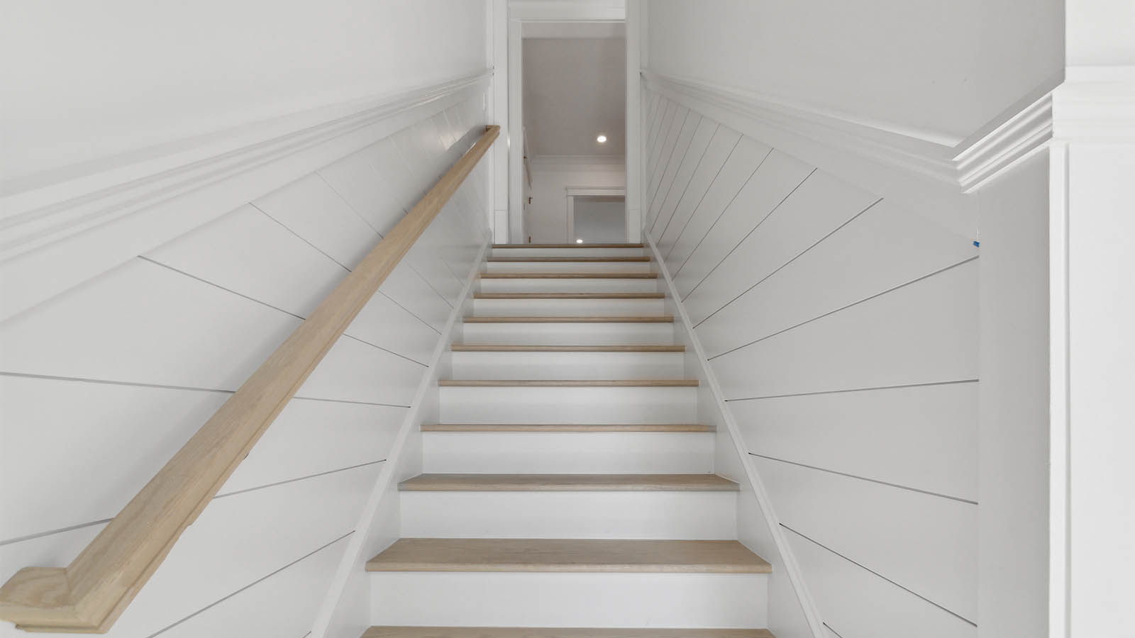 The stairs off the entry lead to the second level living area