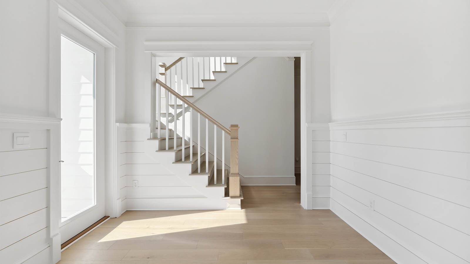 Stairs off the dining area leading to the third level