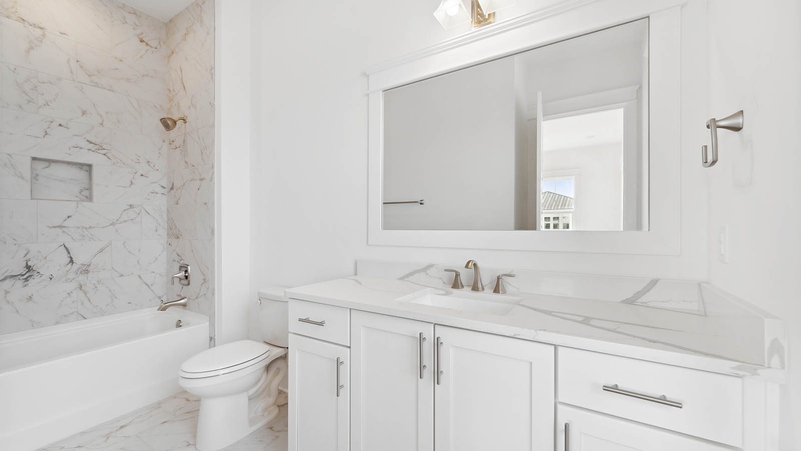 Each bathroom has lower cabinetry for storage