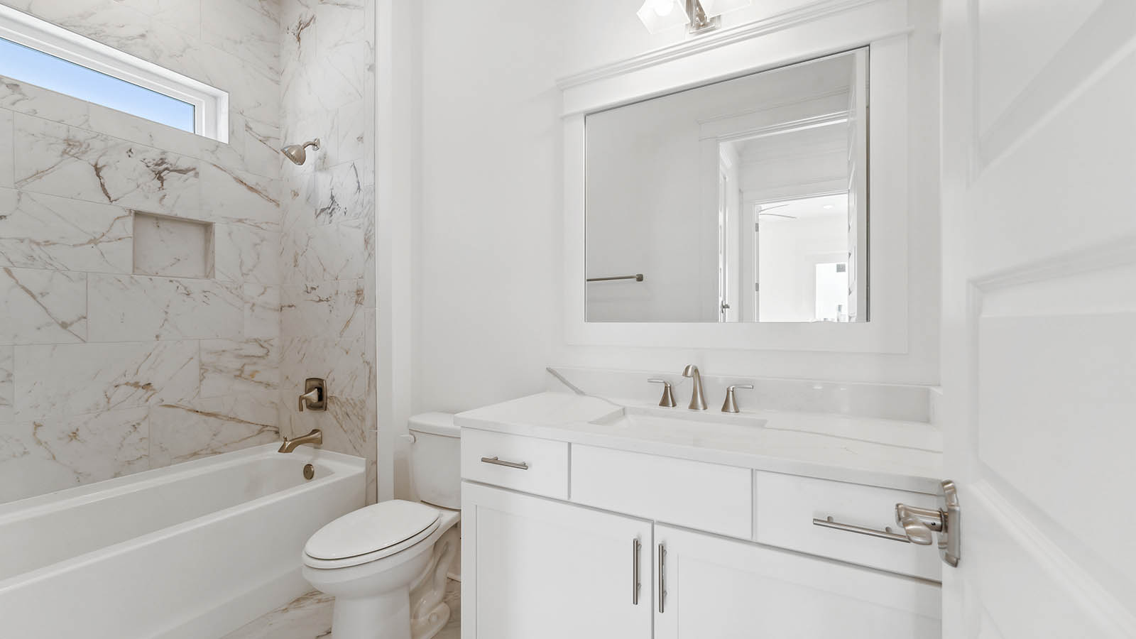 The second level has a shared bathroom with single vanity