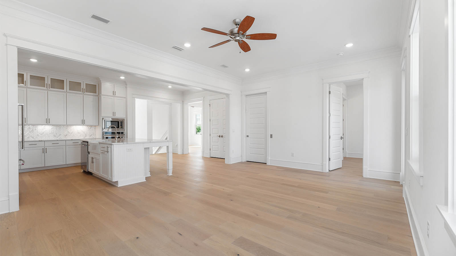 The living area has space for casual dining table and living room set