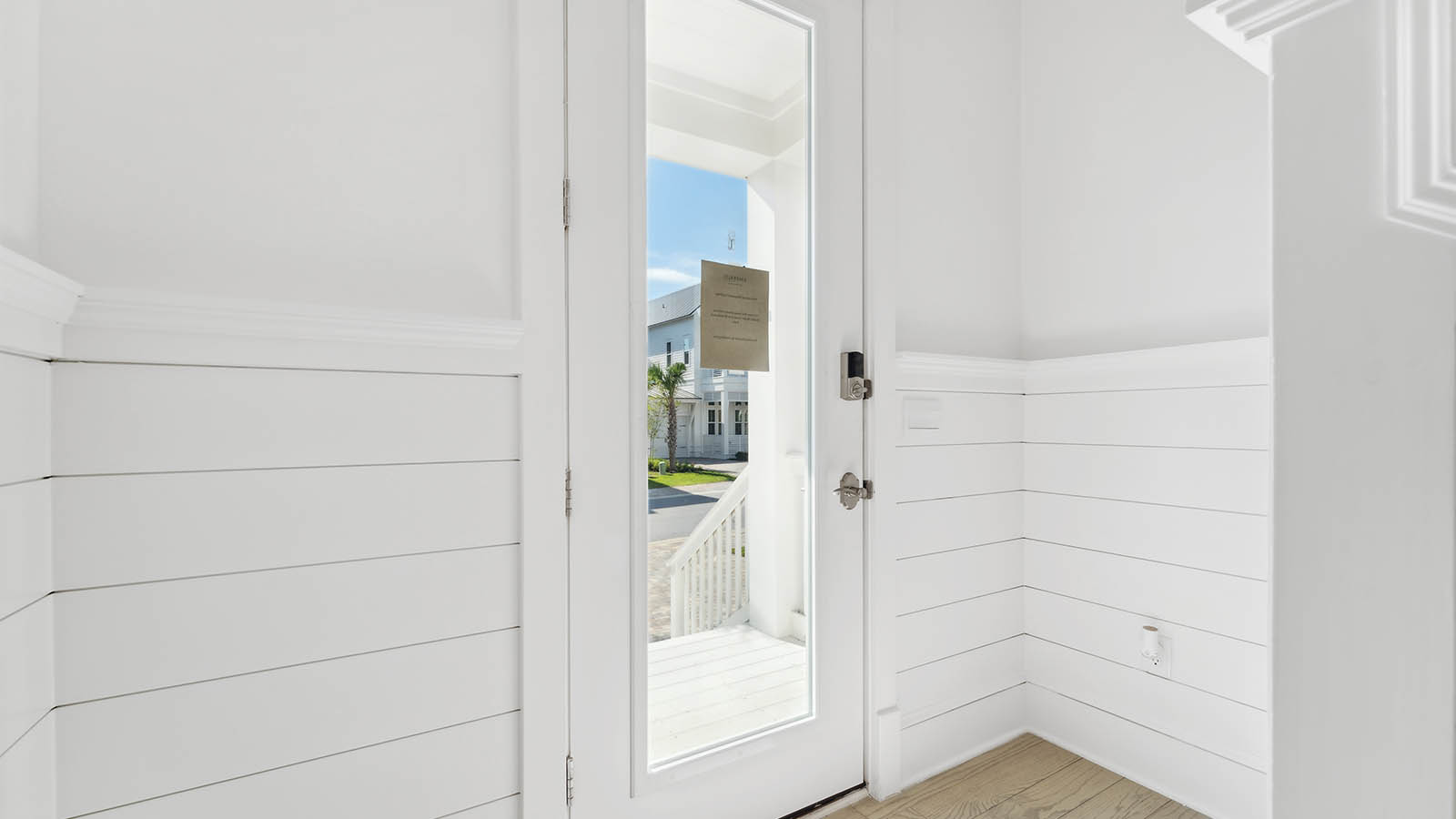 The entry door has a glass window adding to the bright feel of the entry