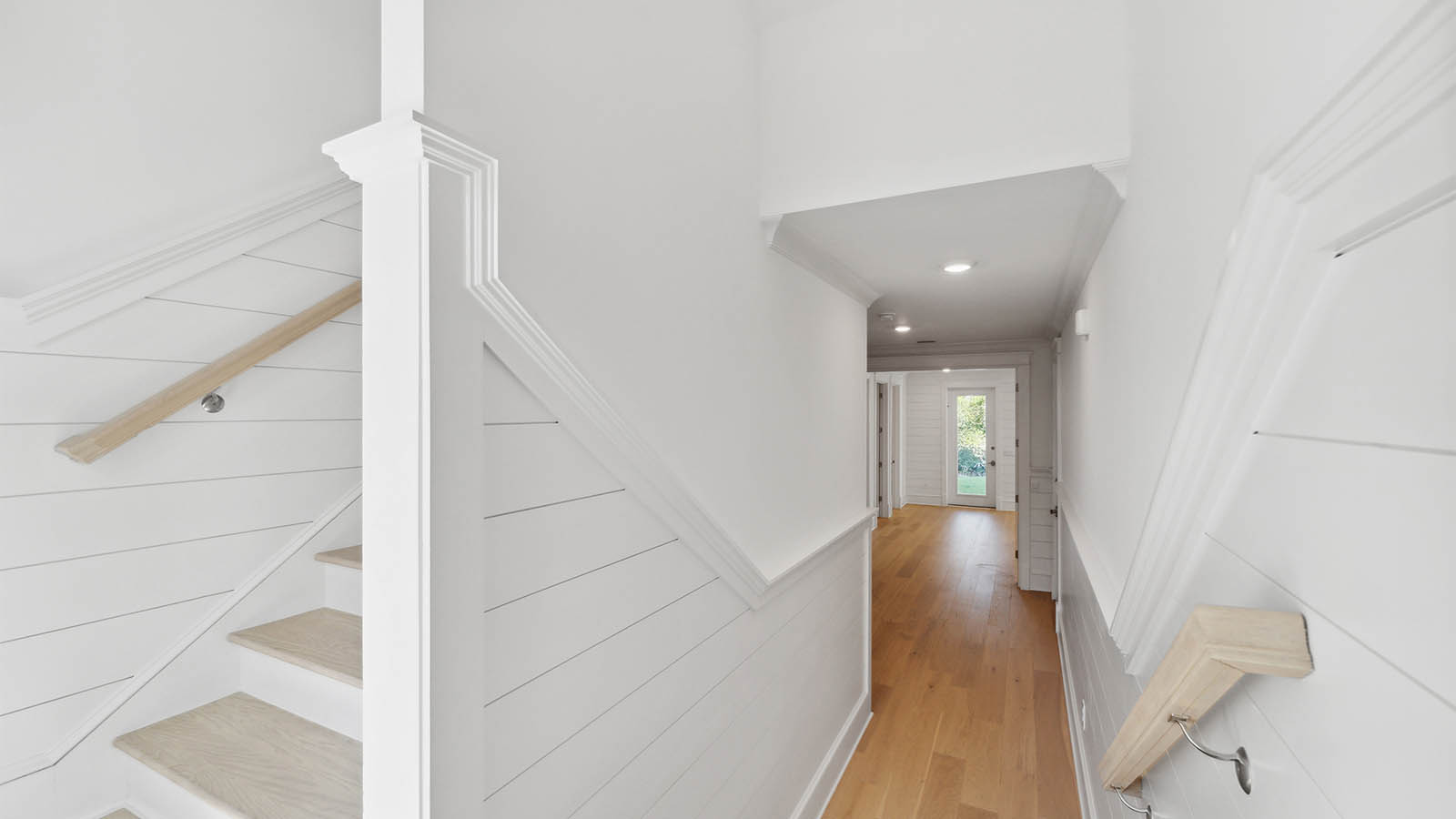 This home has a landing just off the entry with stairs leading to the main level bedroom and stairs to the second level living space
