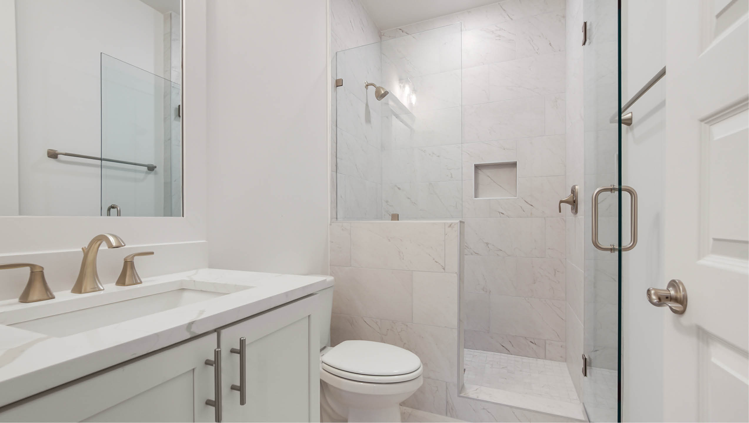 Private bath with tile shower and glass enclosure