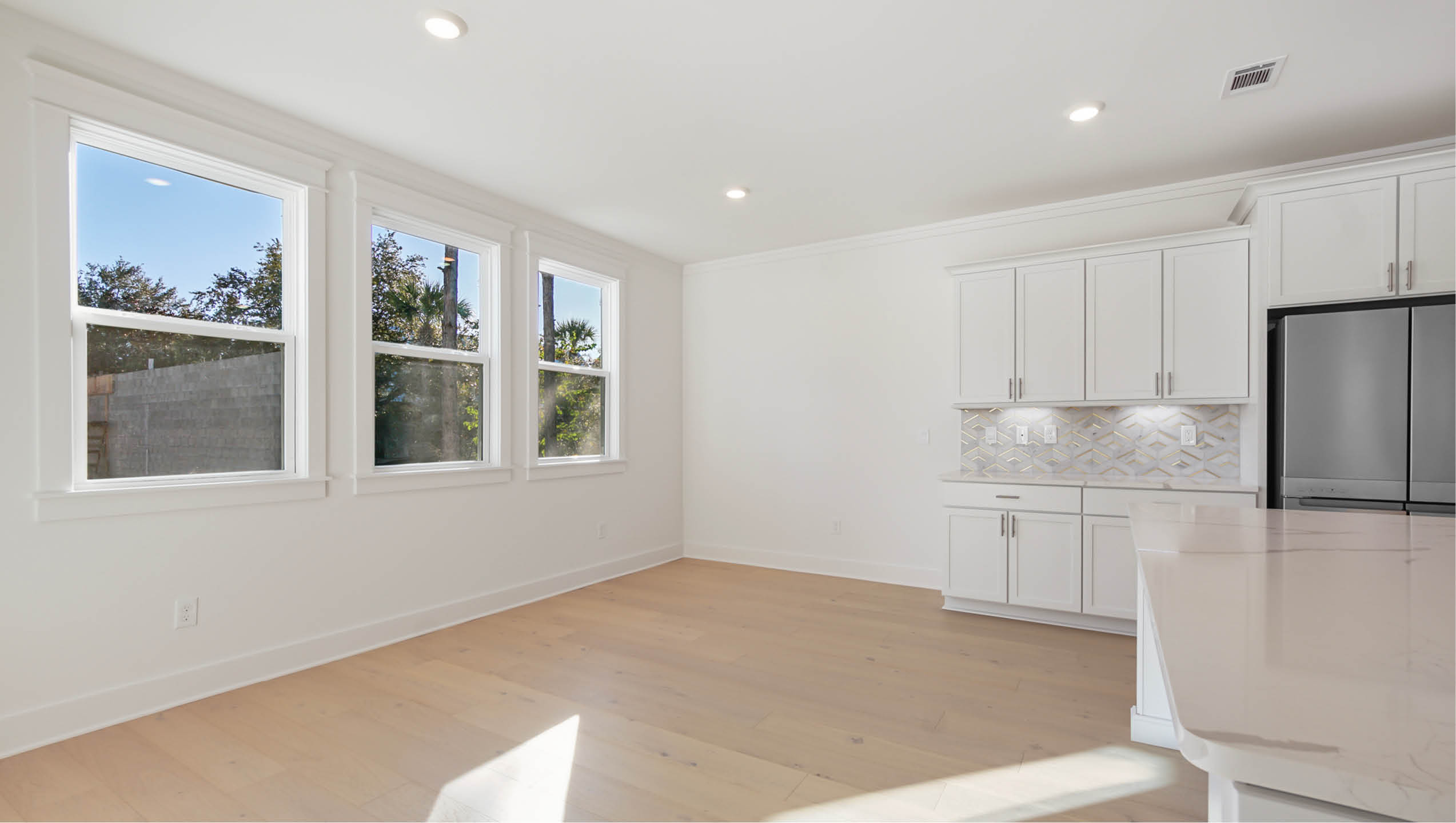 Spacious dining area overlooking the backyard