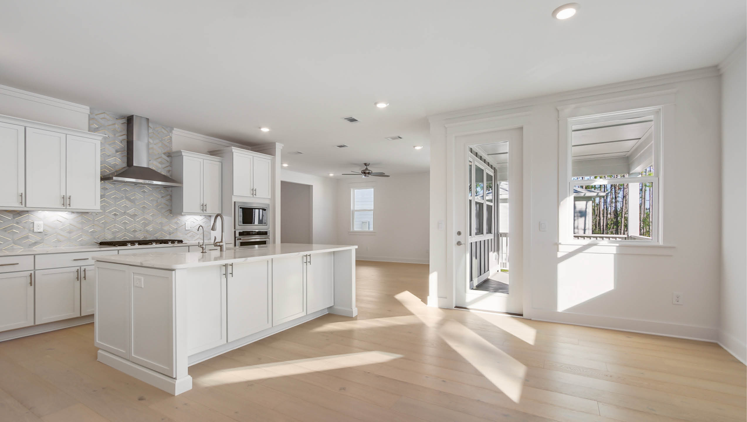 Open kitchen with upper and lower cabinetry with soft close doors