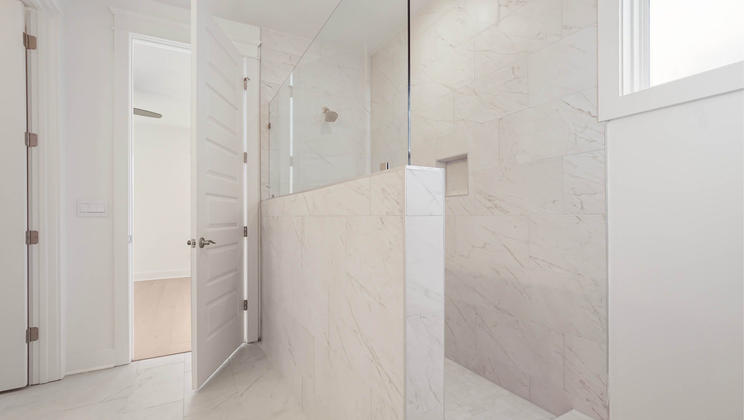 Open shower with glass partition