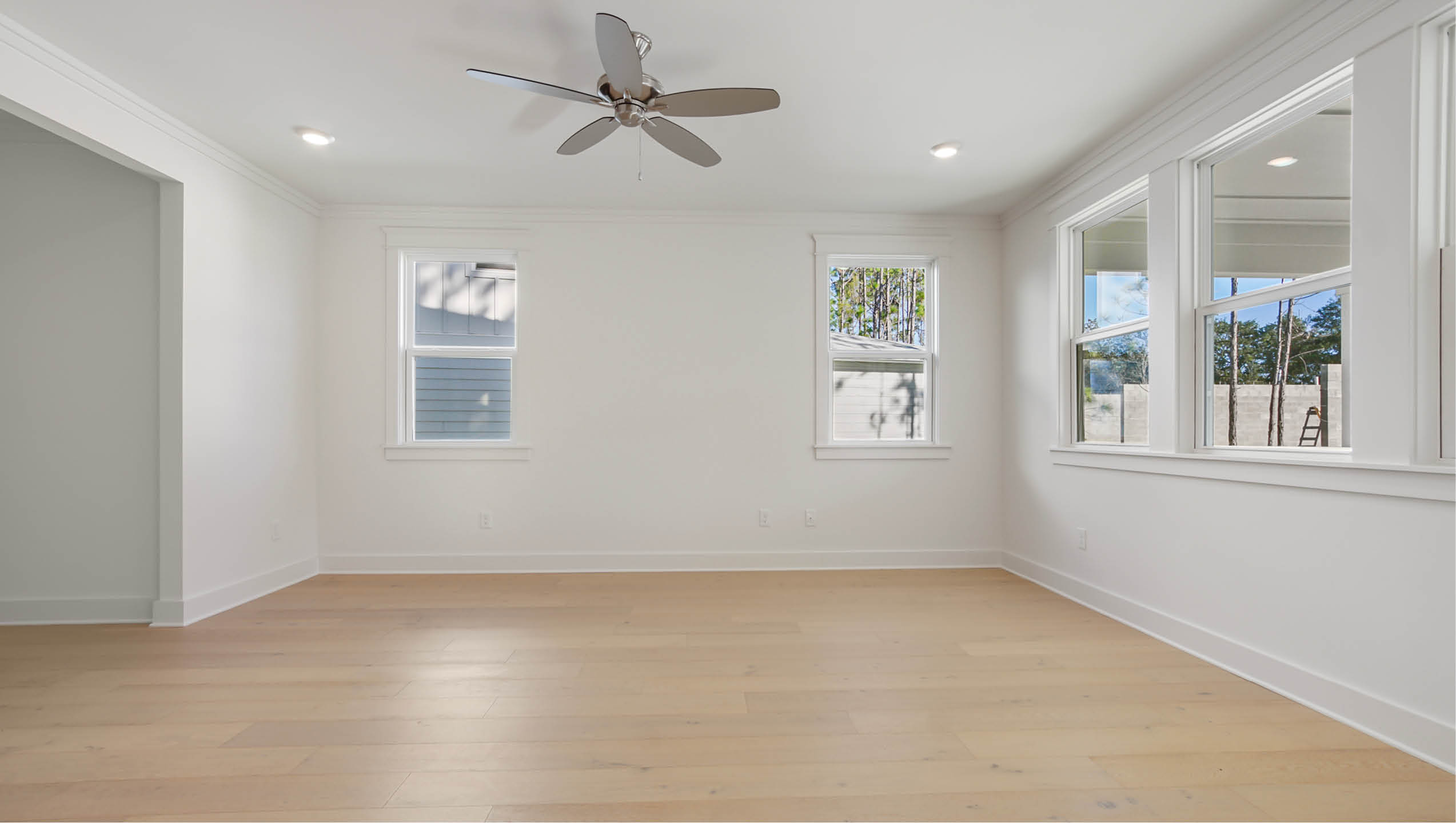 Open great room with expansive windows for abundant natural light