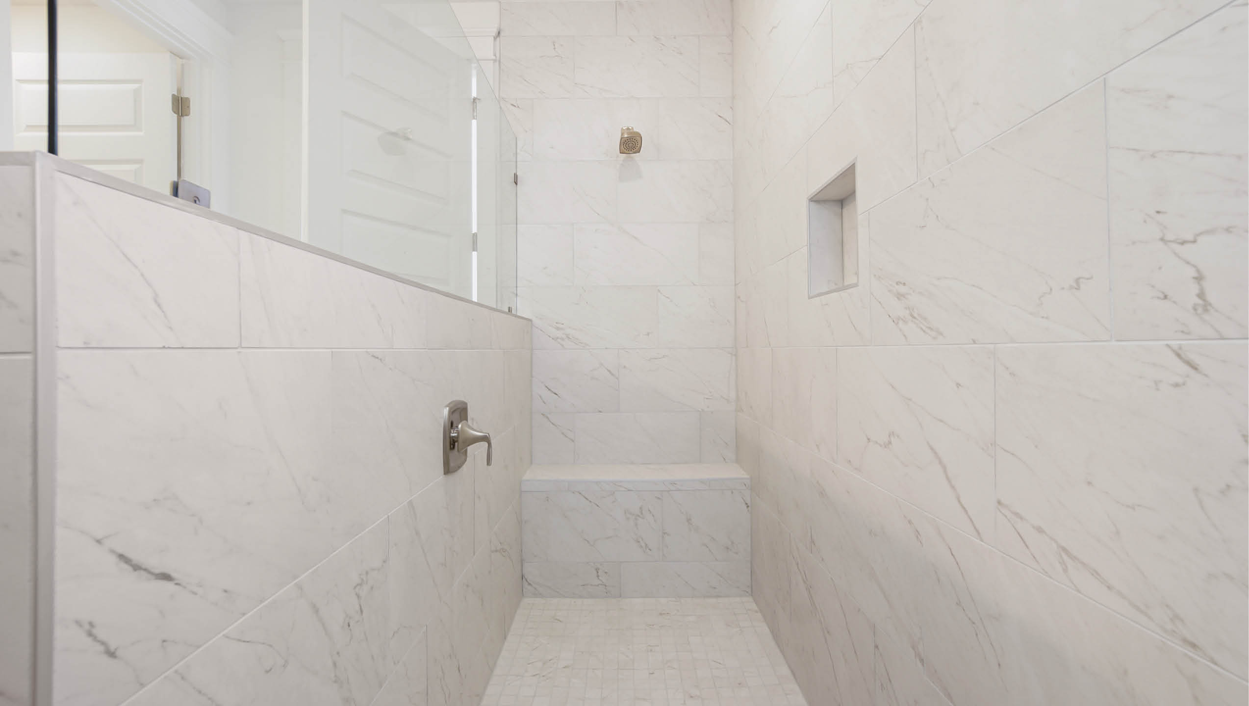 Primary bathroom with oversize shower and bench