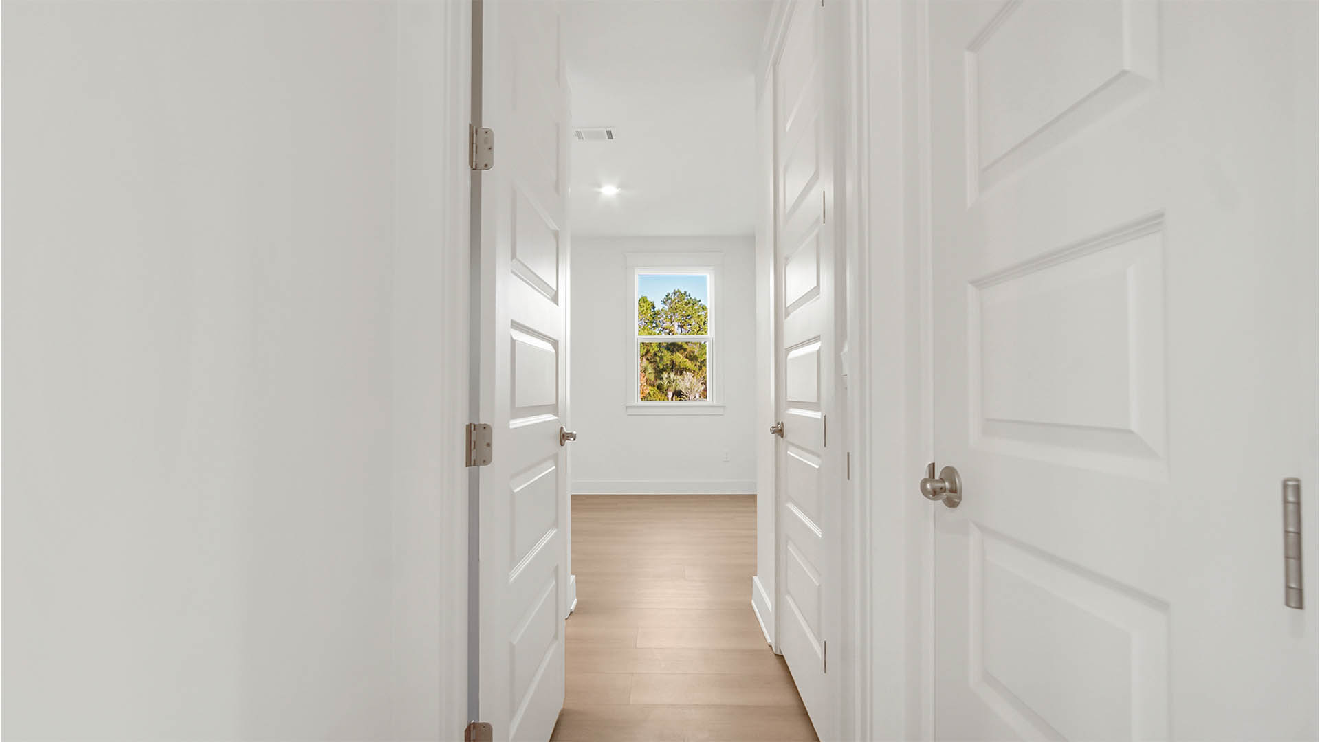 Halway leading to bedroom two on the main level