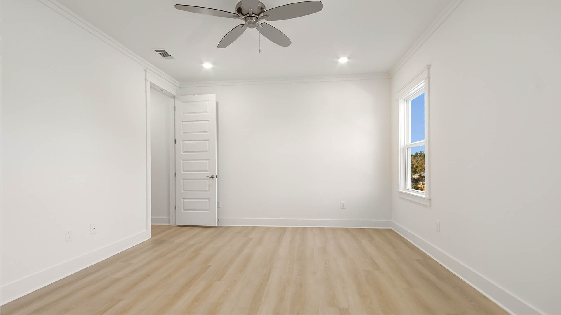 Primary bedroom with overhead ceiling fan