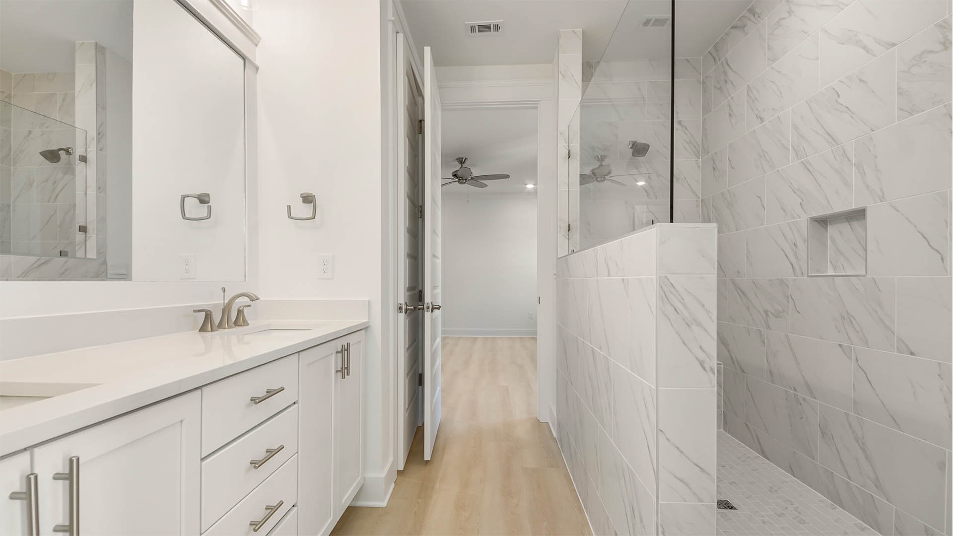 Large open shower with tile and glass window