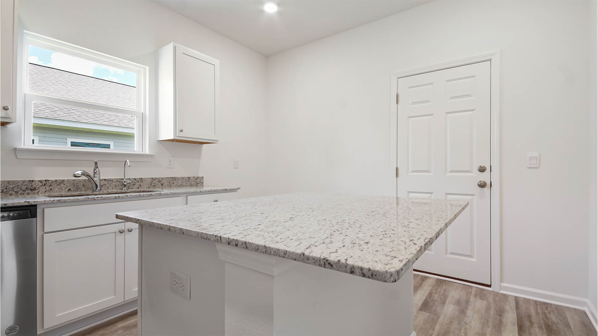 Kitchen Island with granite countertops and space for bar seating