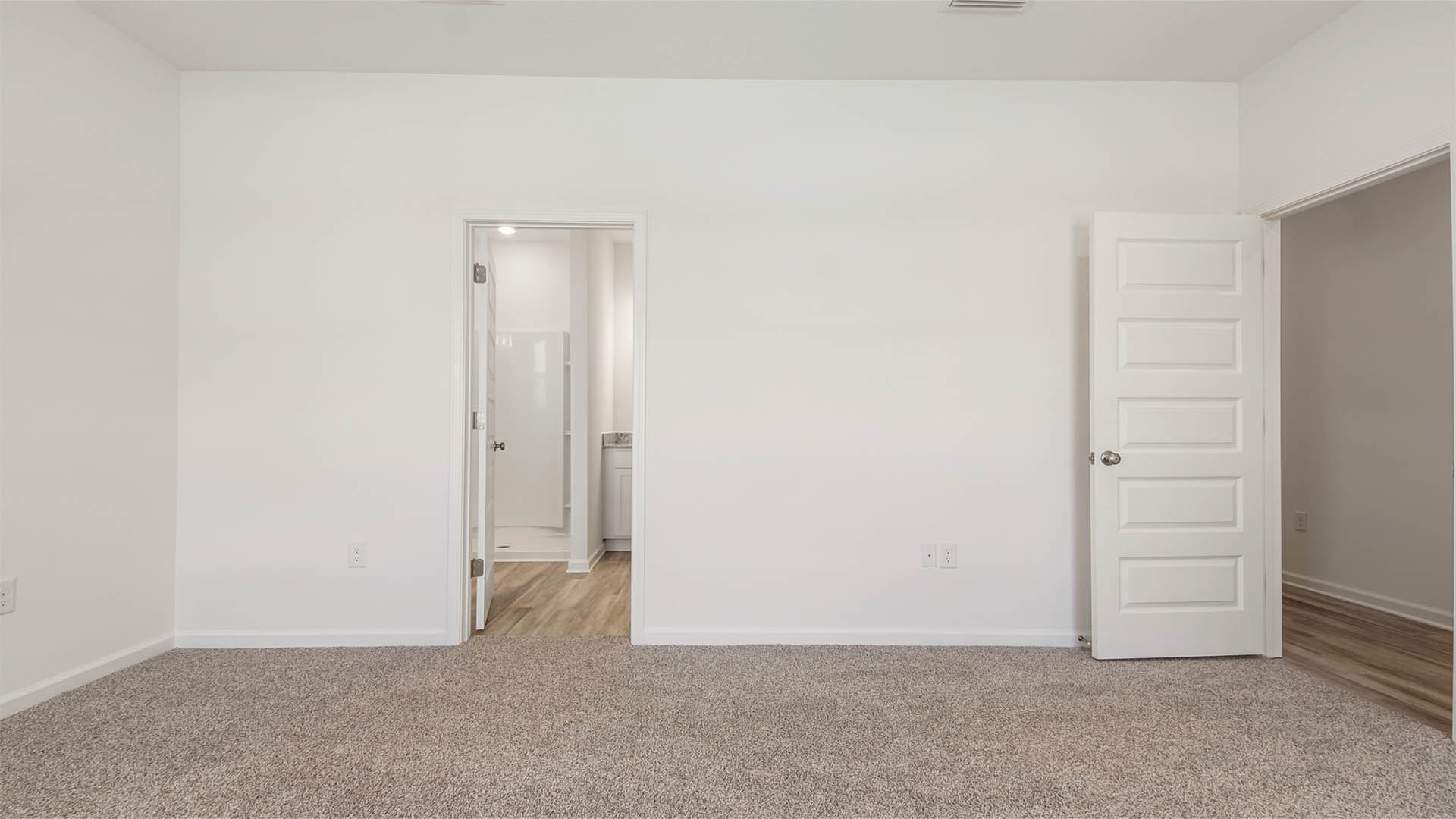 The primary bedroom has a spacious ensuite bathroom