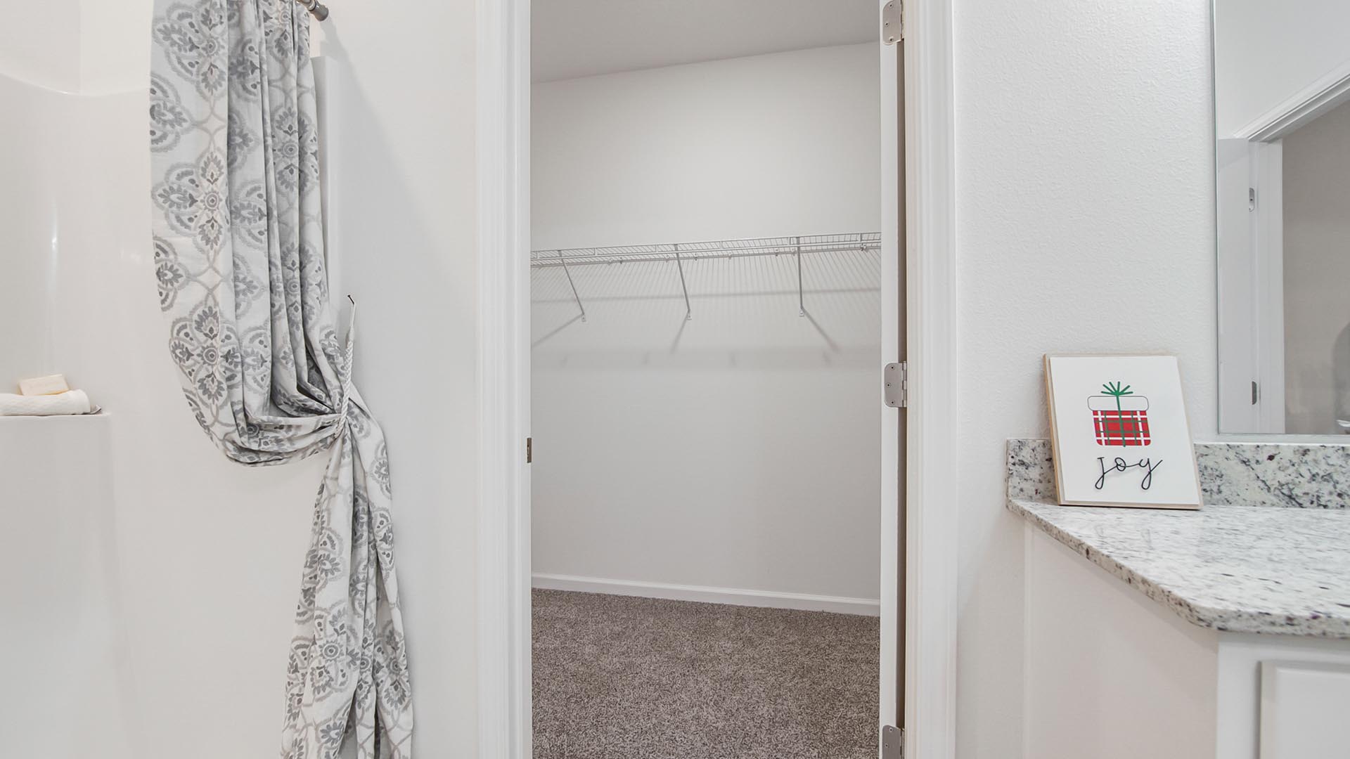 The private bathroom features a spacious closet