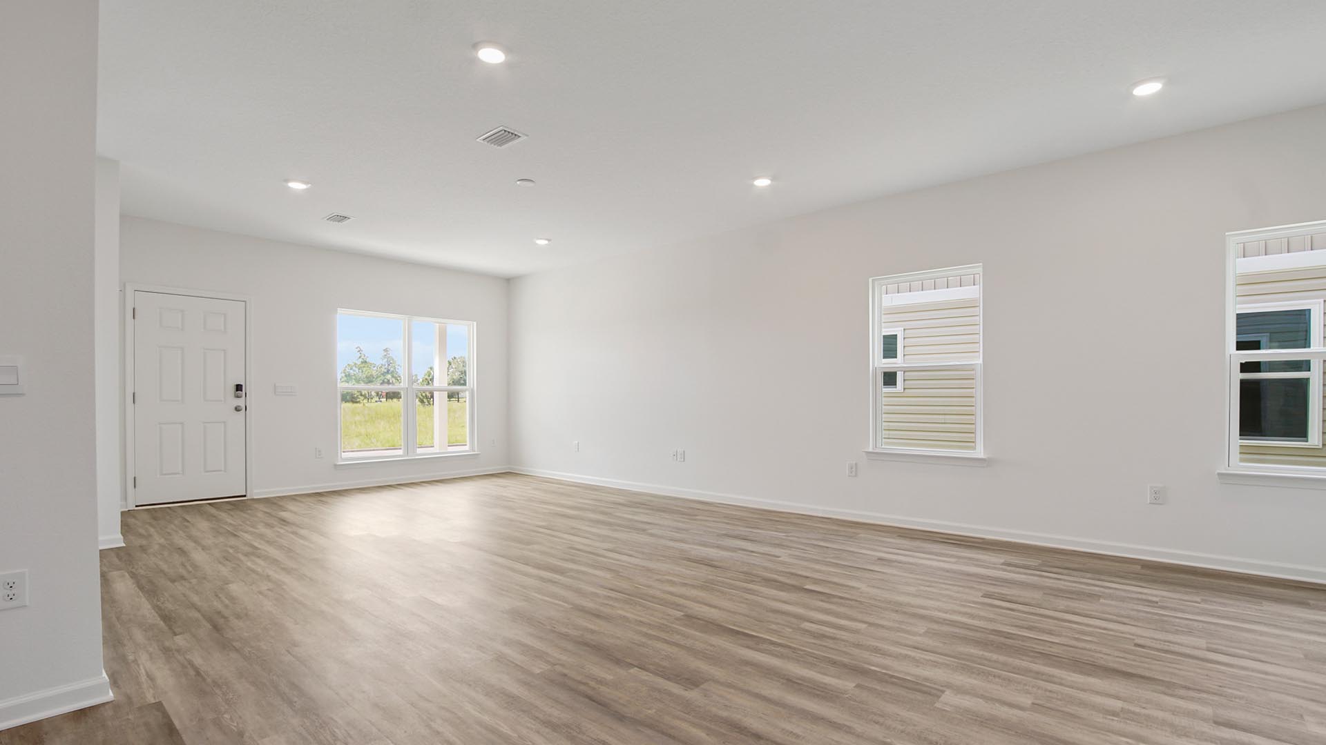 View from the kitchen area back to the great room and entry