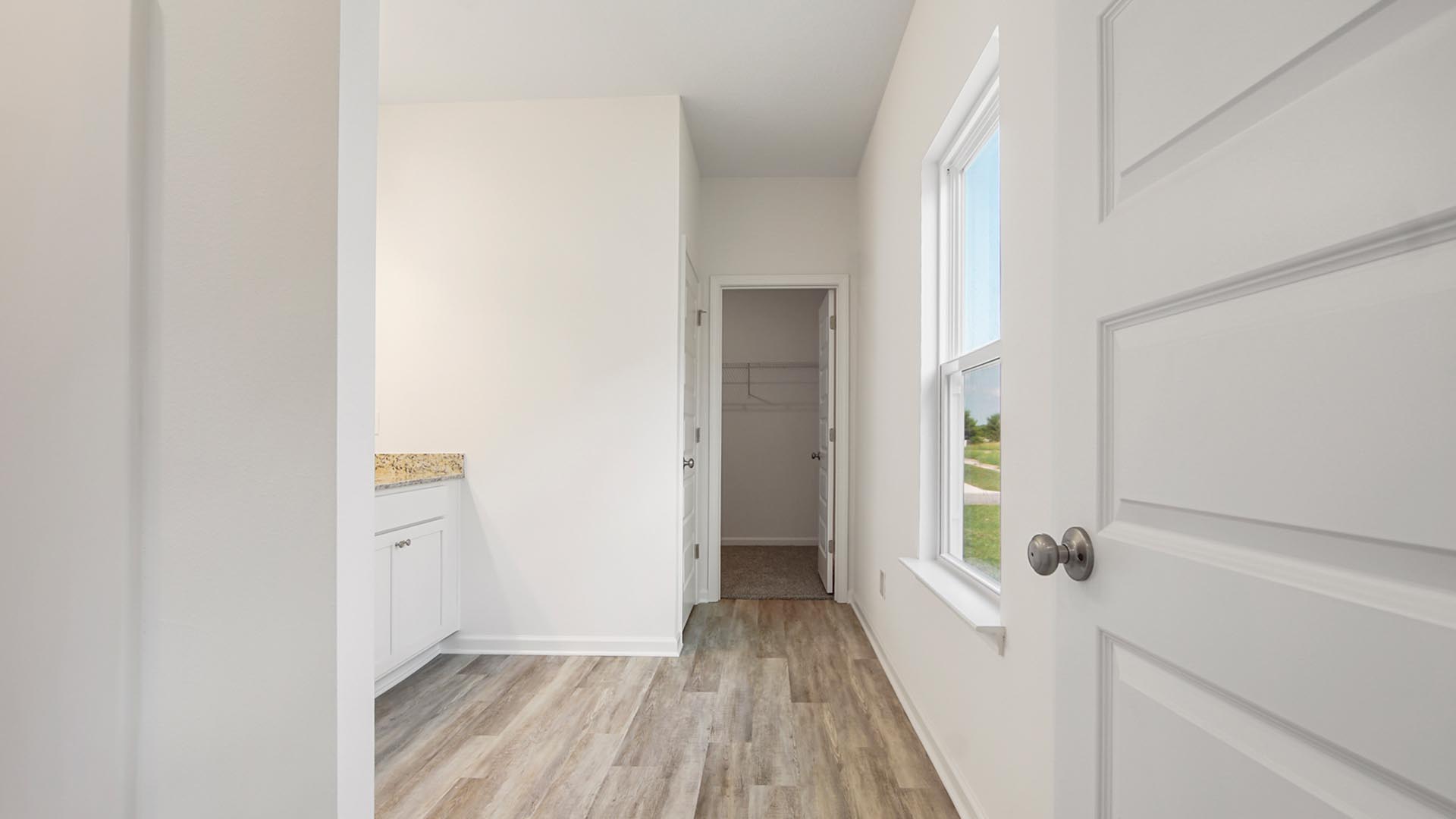 The primary bathroom has EVP flooring and features a nice size vanity