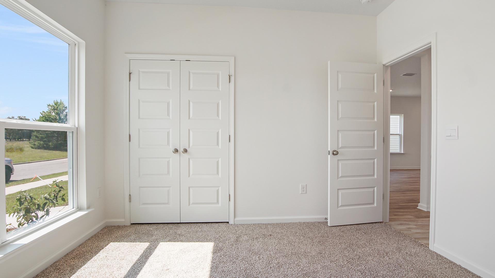 The main level guest bedroom has a spacious closet