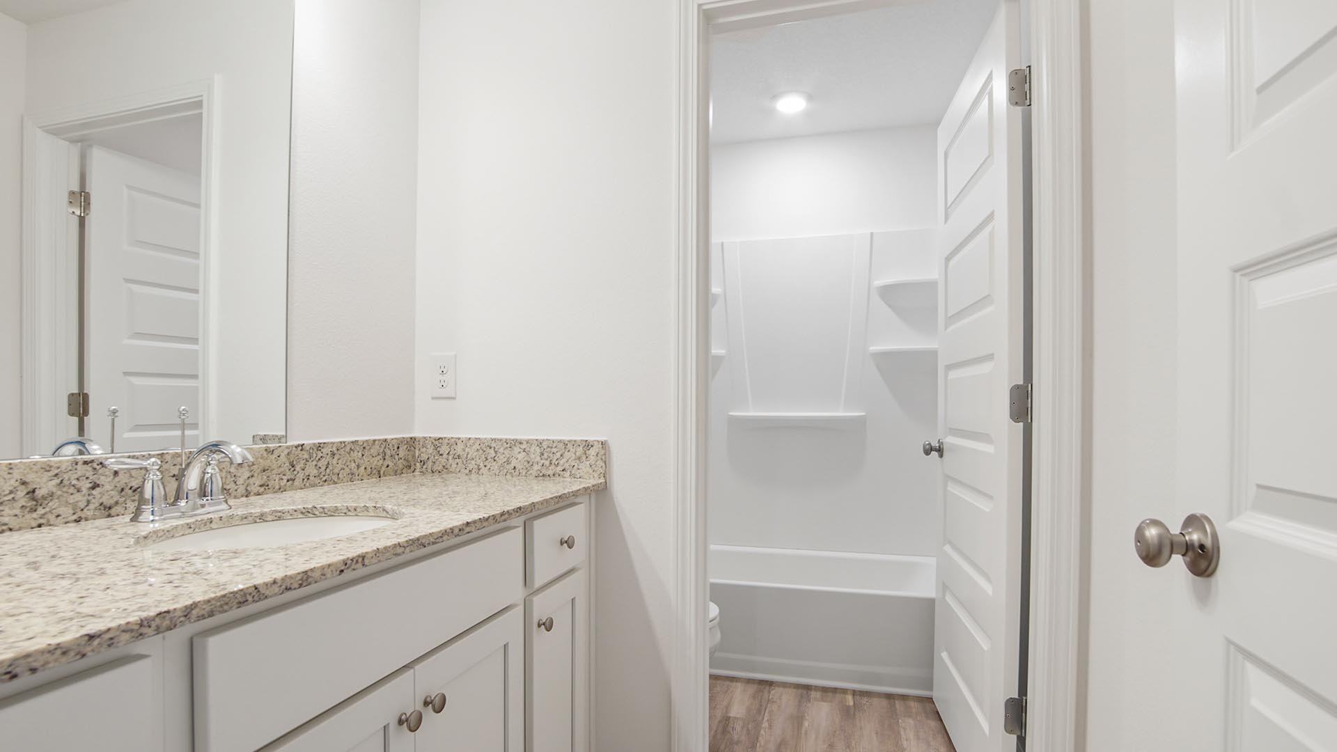 Shared bathroom between bedrooms two and three on second level
