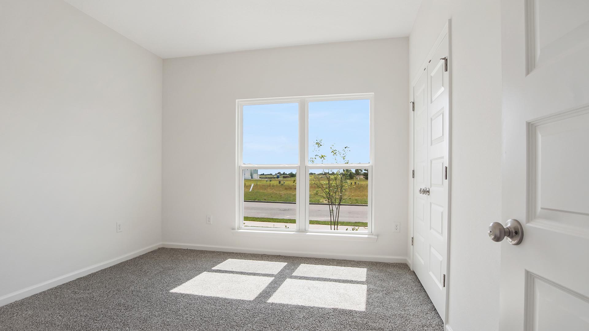The guest bedroom could be used as an office and has a picture window for plenty of light