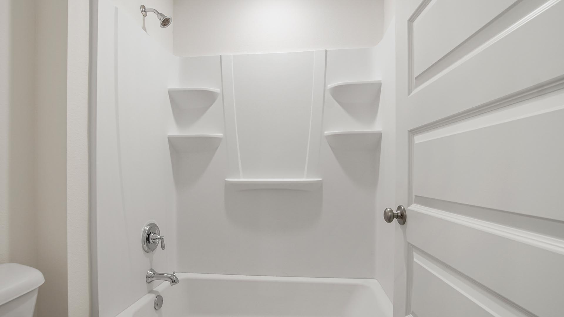 The shared bathroom has a shower tub combination