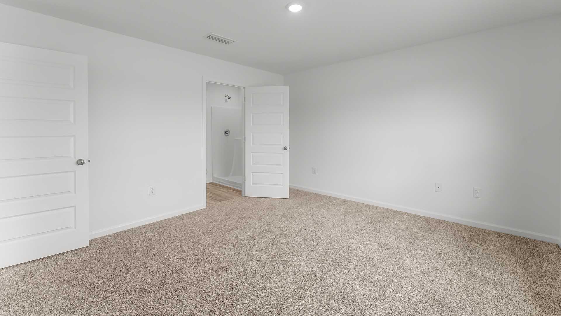 The primary bedroom is located off the living room