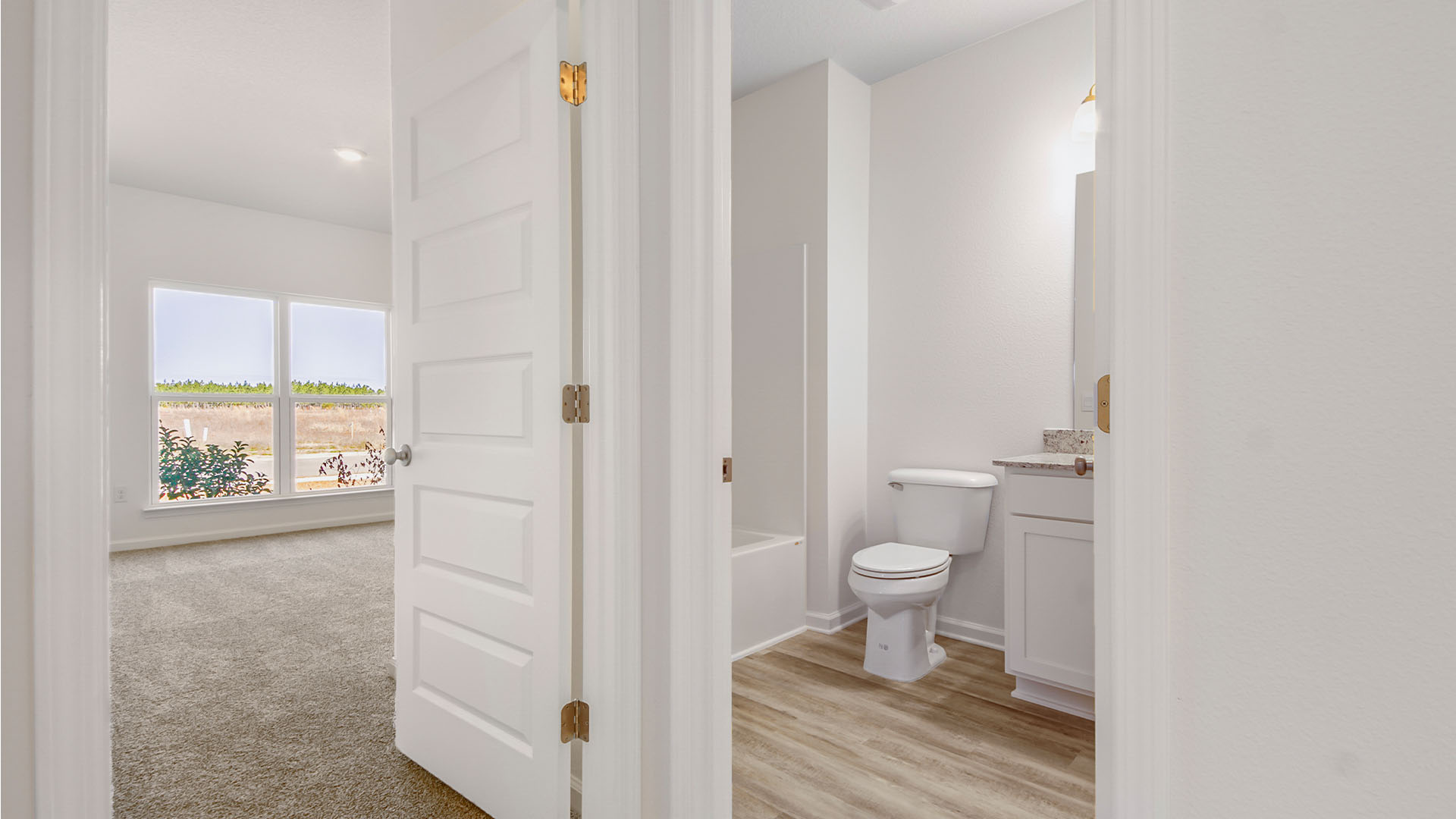 There are two additional bedrooms with a shared bath