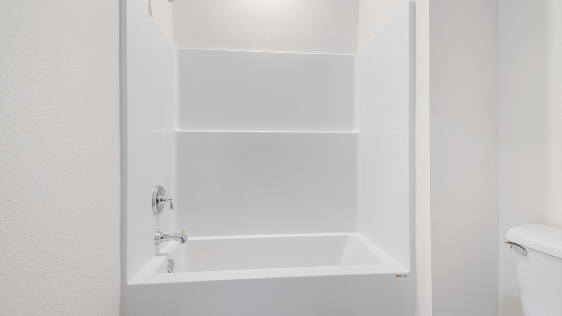 The shared bathroom has a shower tub combination