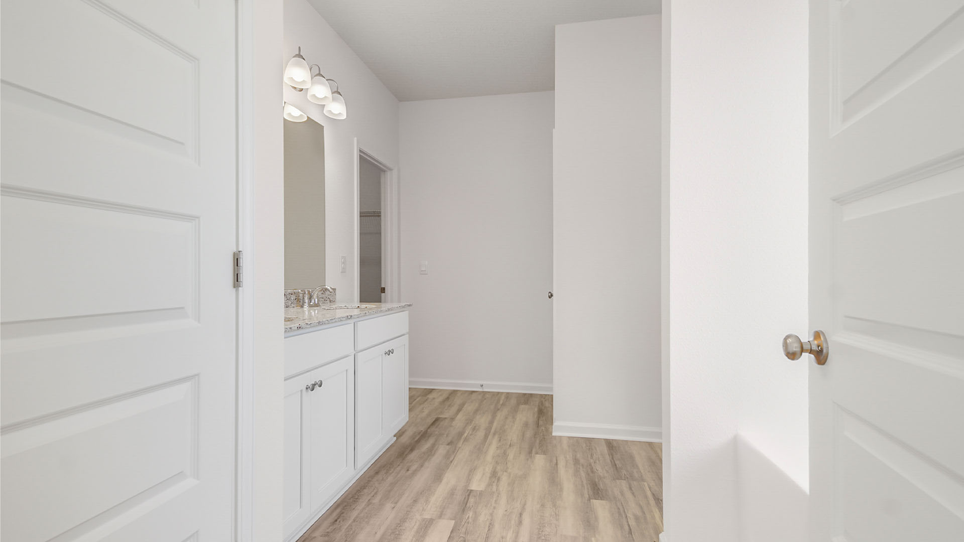 The primary bathroom has a dual sink vanity