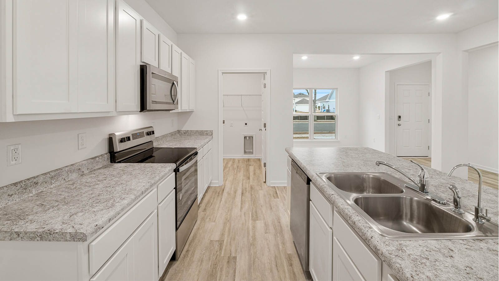 The center island is equipped with a dual sink granite countertops and dishwasher