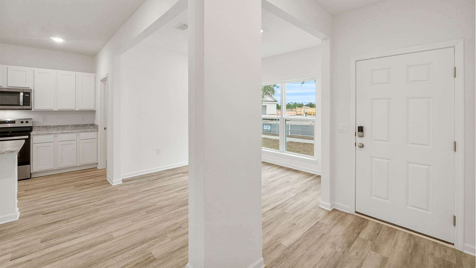 Entry of the home opens to the appointed dining area and kitchen