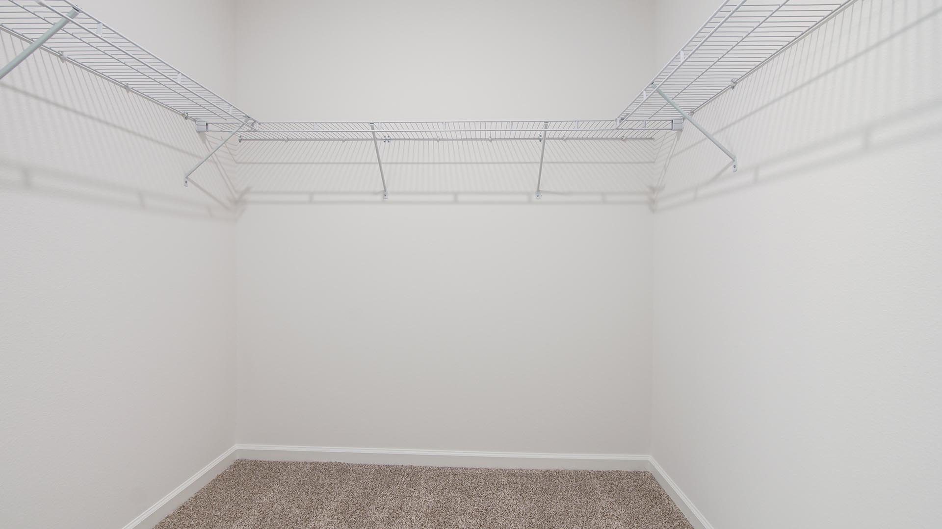 The primary bathroom has a large walk in closet
