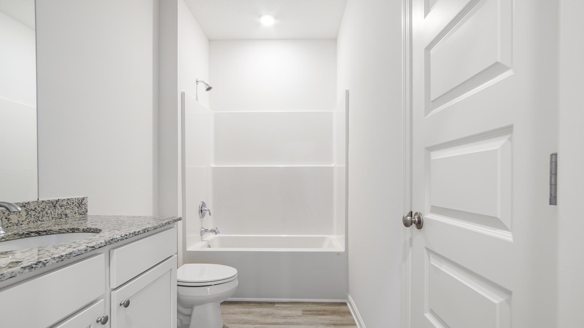 The shared bathroom is between bedrooms two and three and has a shower tub combination