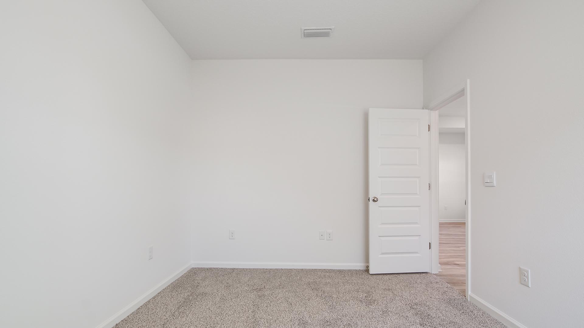 Bedroom two has carpet and features ample closet space